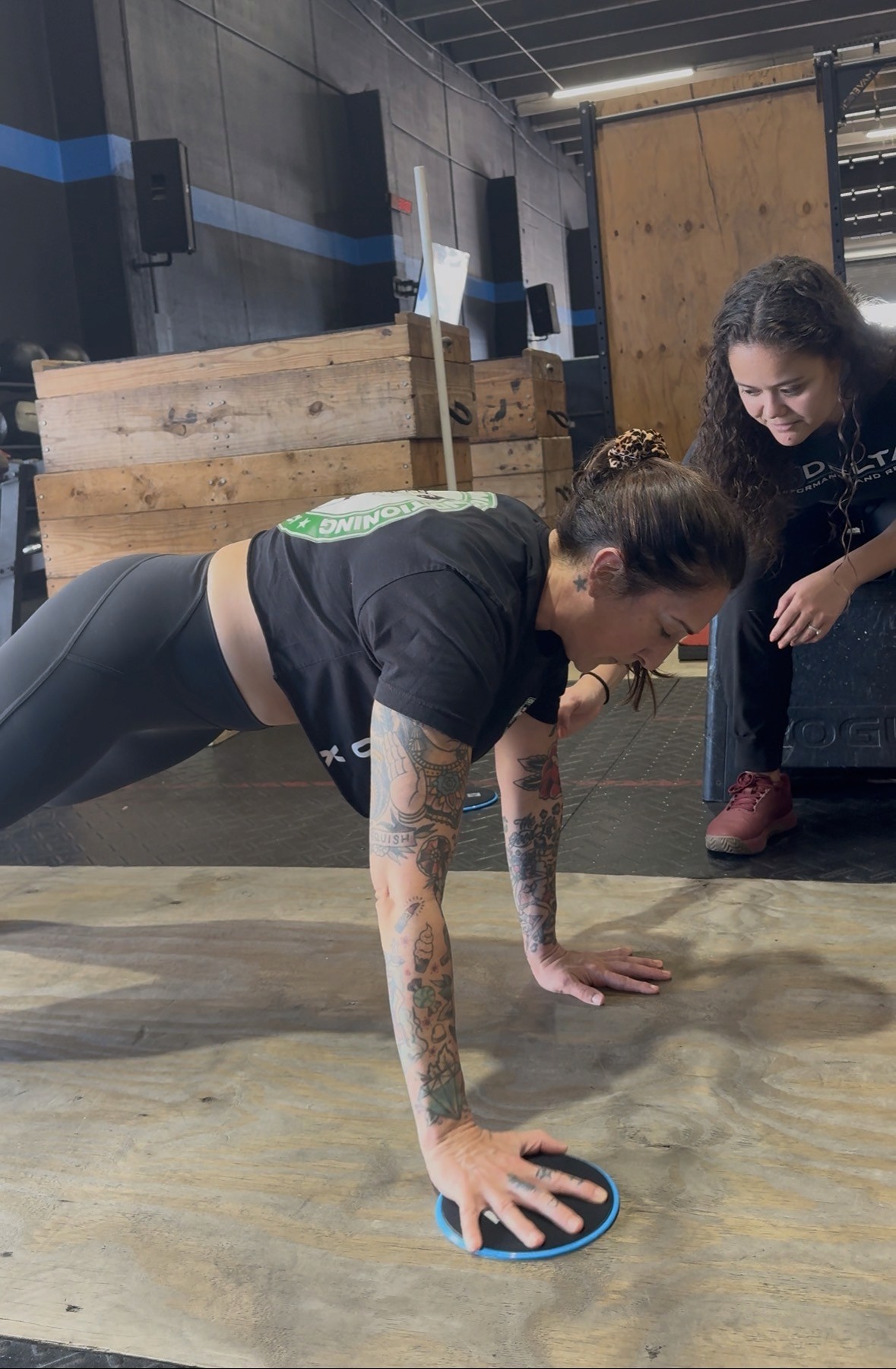 Focused female gymnast balancing with precision, demonstrating core control and body awareness—key elements in performance therapy and injury prevention.