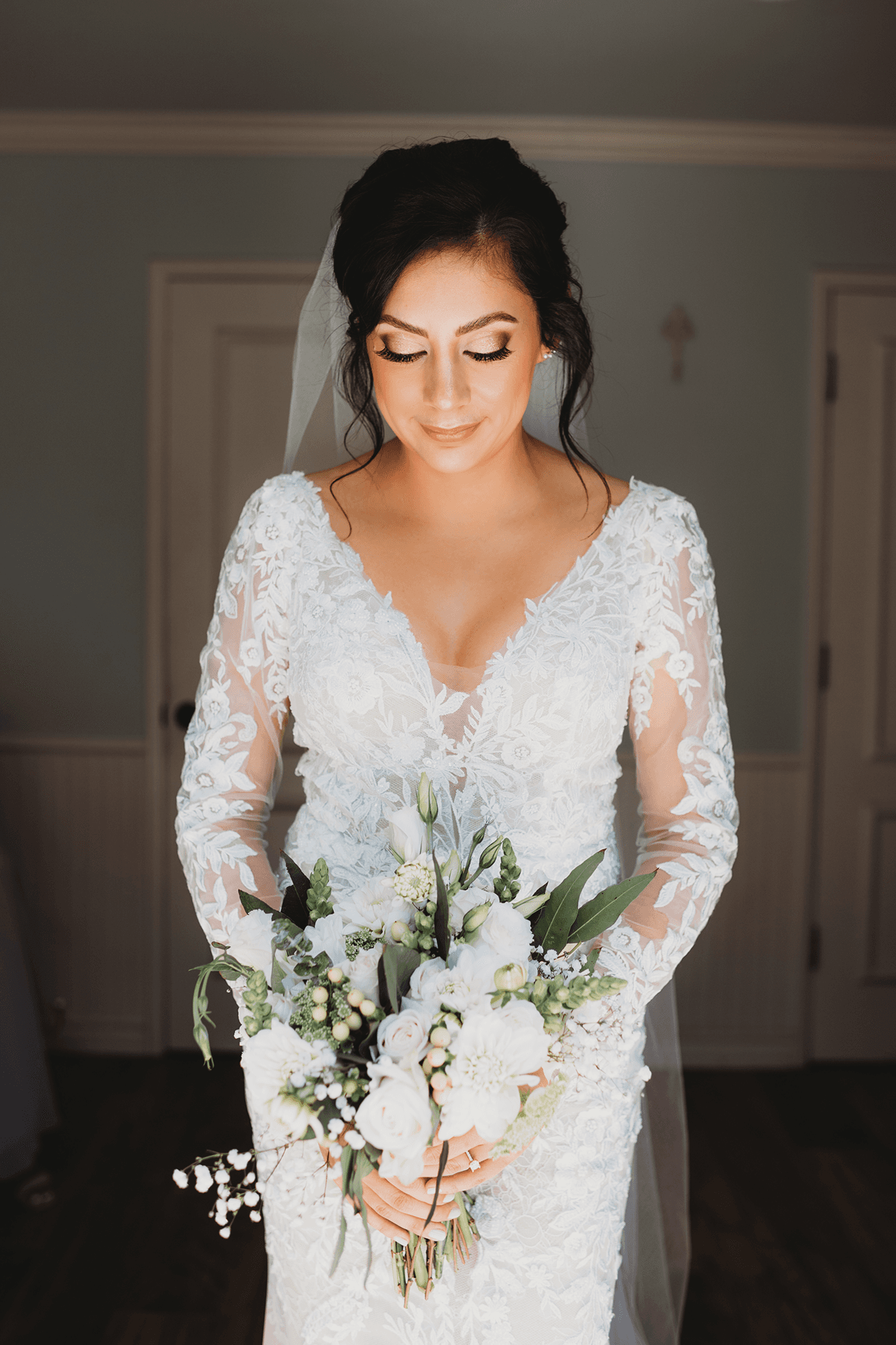 Flat lay wedding details with bouquet, rings, and sparkling bridal heels