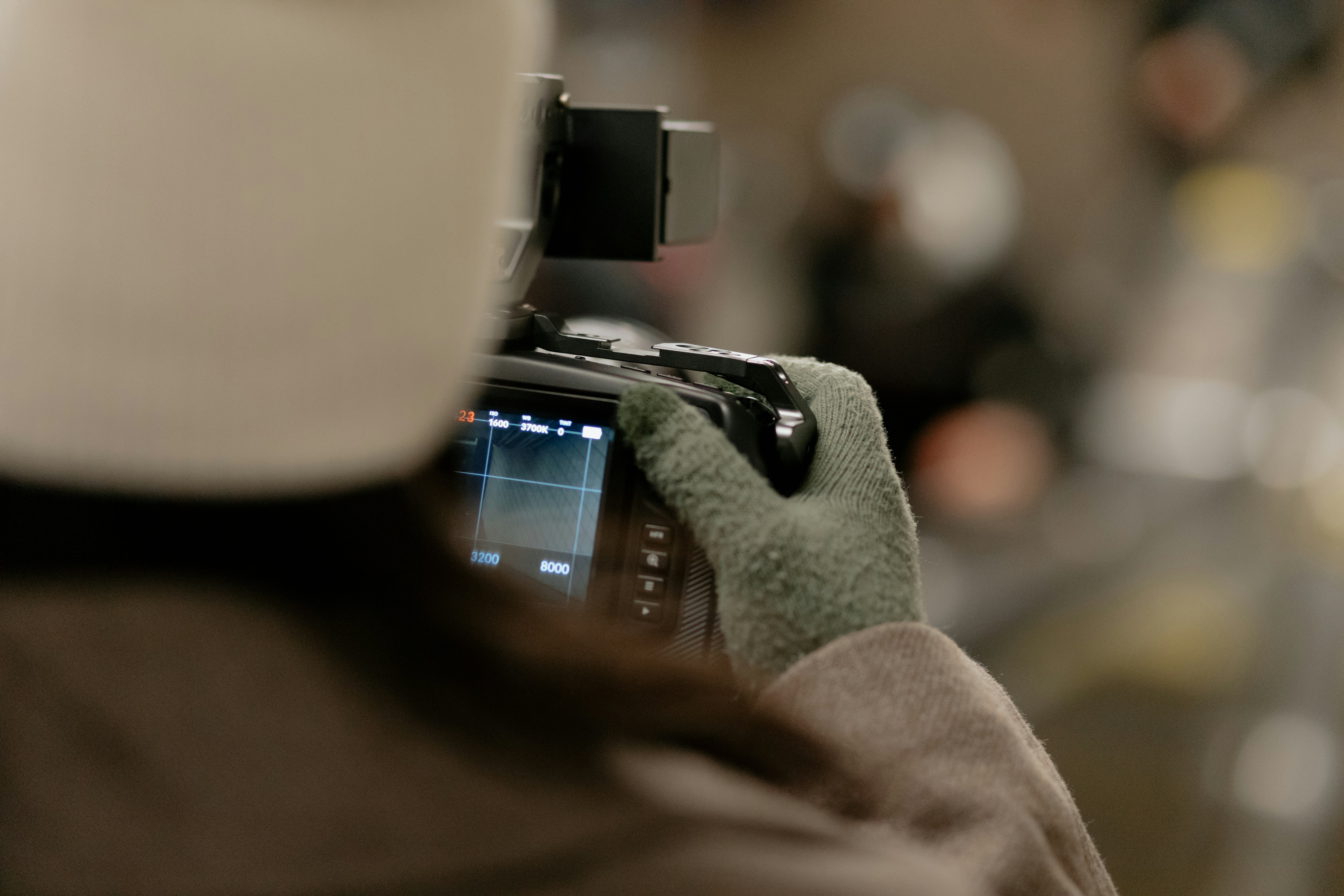 person holding black smartphone with camera