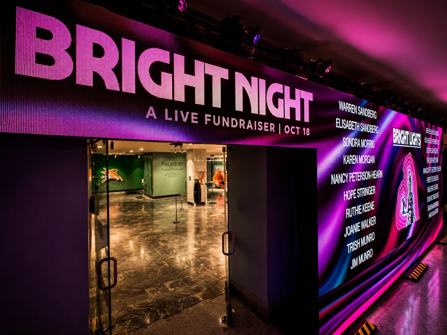'Bright Night — A Live Fundraiser' LED marquee in magenta light at Nashville's Parthenon — event production by UpLight Technologies