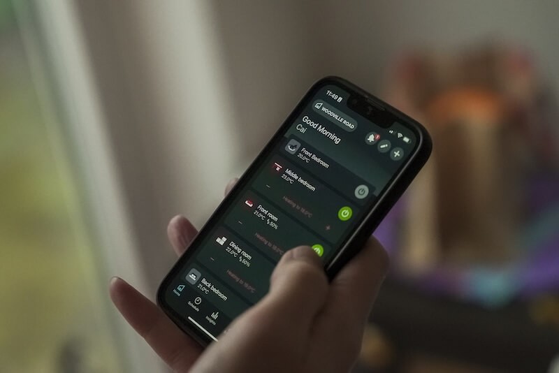 Top floor windows, wall and roof of a 1930s semi-detached home shot from below.