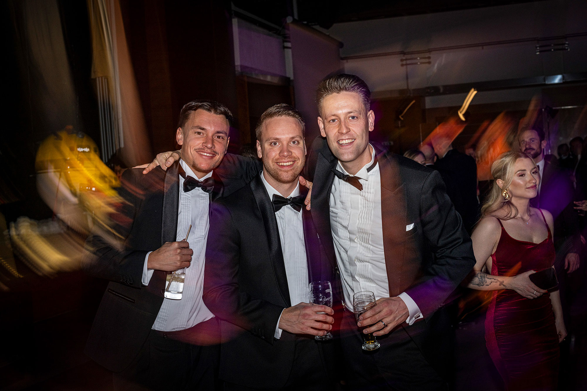 Corporate conference gala afterparty with guests networking and celebrating.