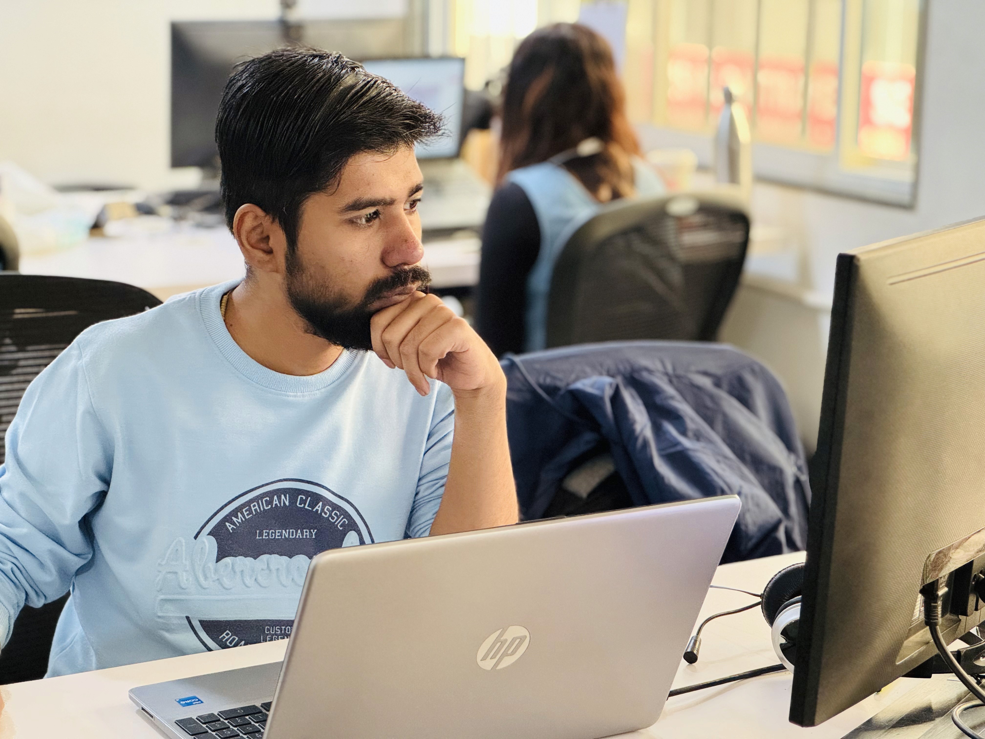 A developer working on code in a well-lit and organized workspace