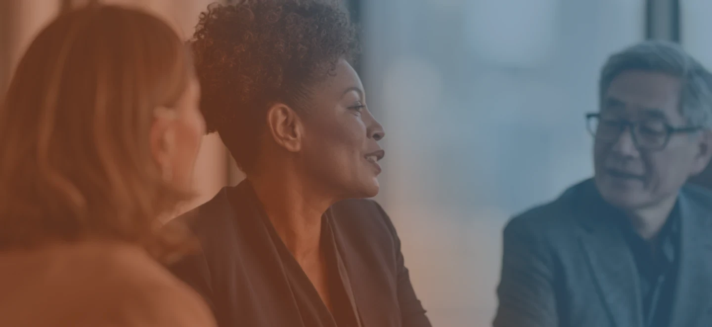 Recruiters talking at desk