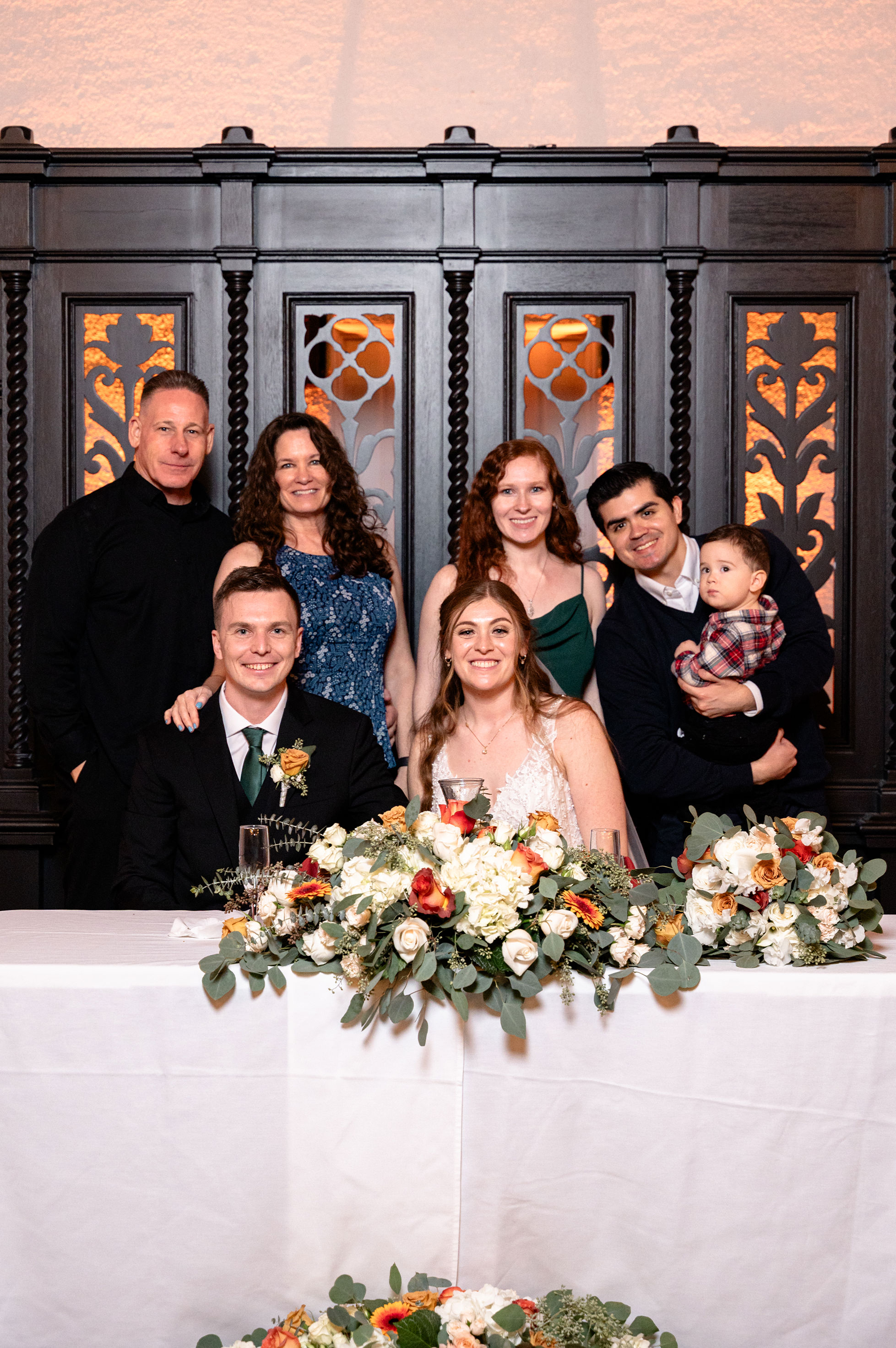 Flat lay wedding details with bouquet, rings, and sparkling bridal heels