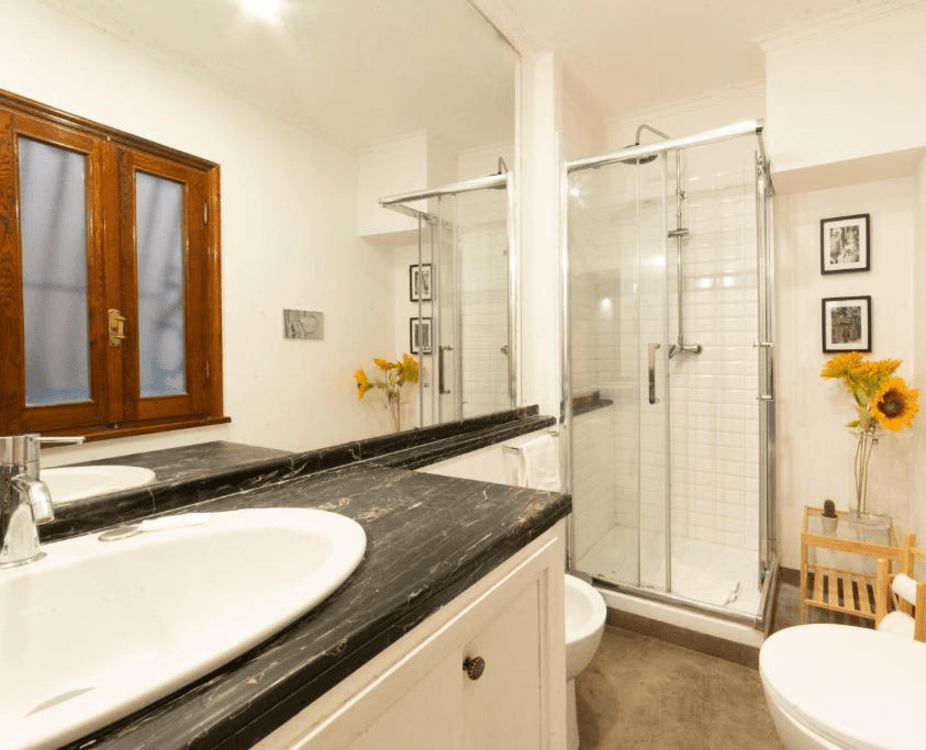 Modern office desk with angular design and leather chair