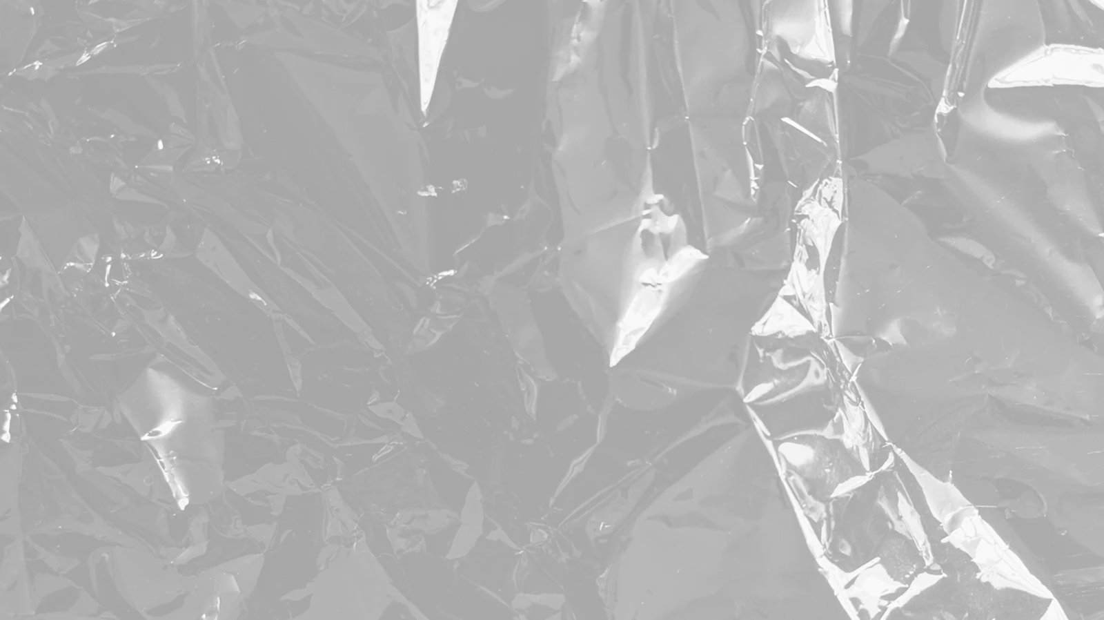 white textile on brown wooden table