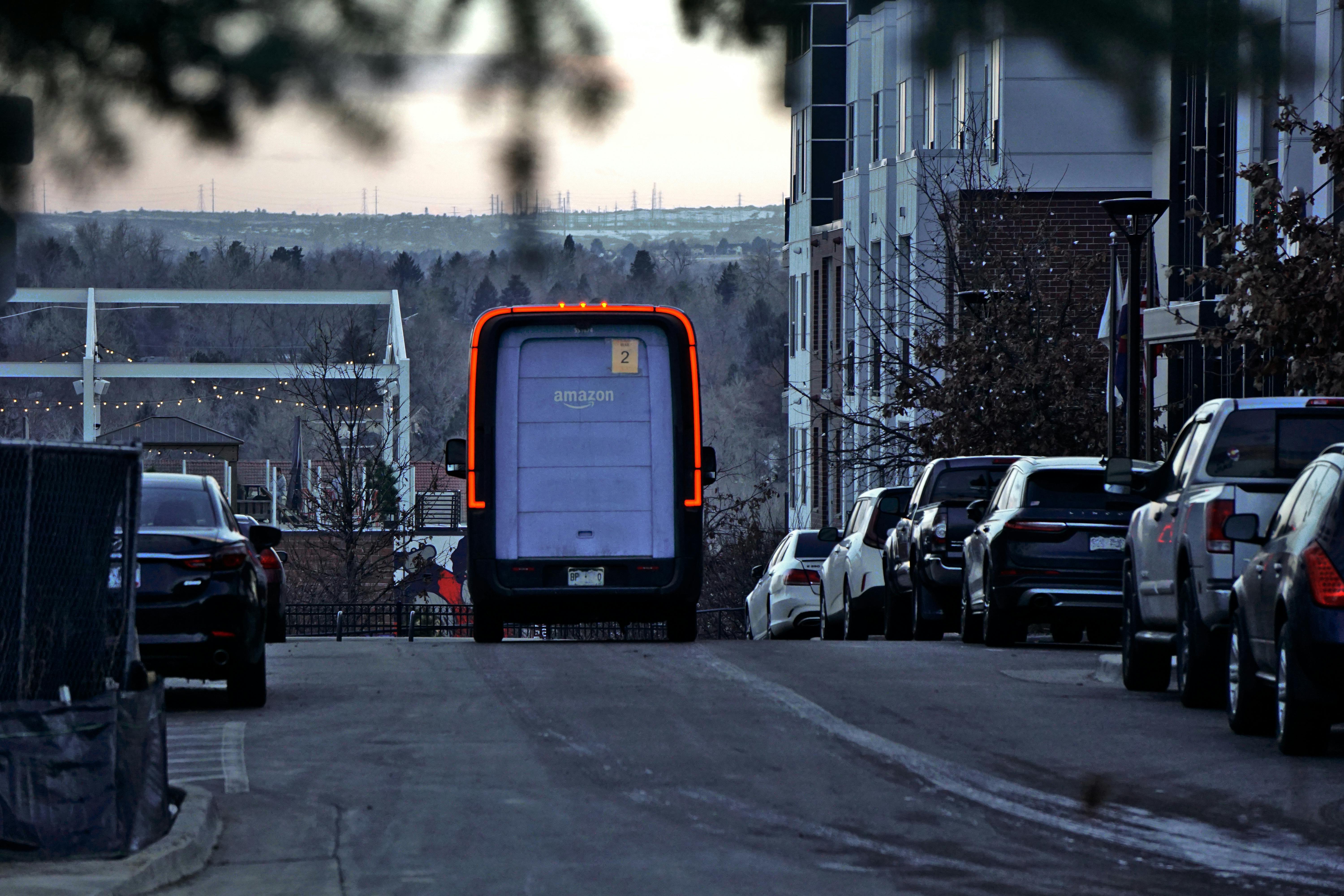 Amazon truck delivery driving away representing the make amazon pay strike