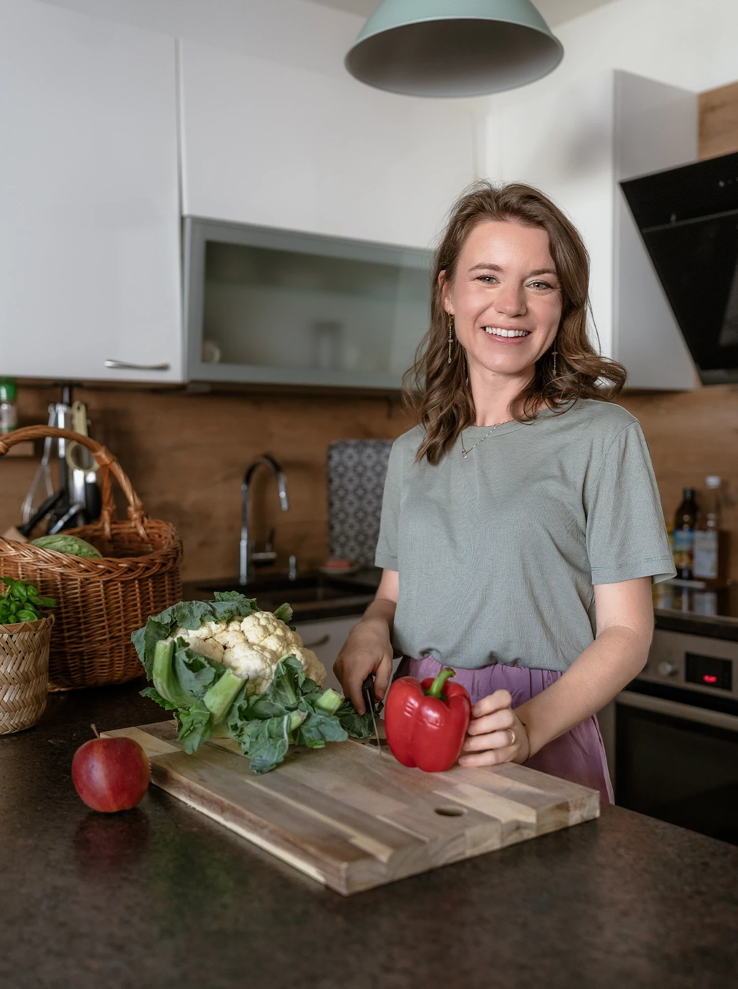 Woman in kitchen making a healthy meal