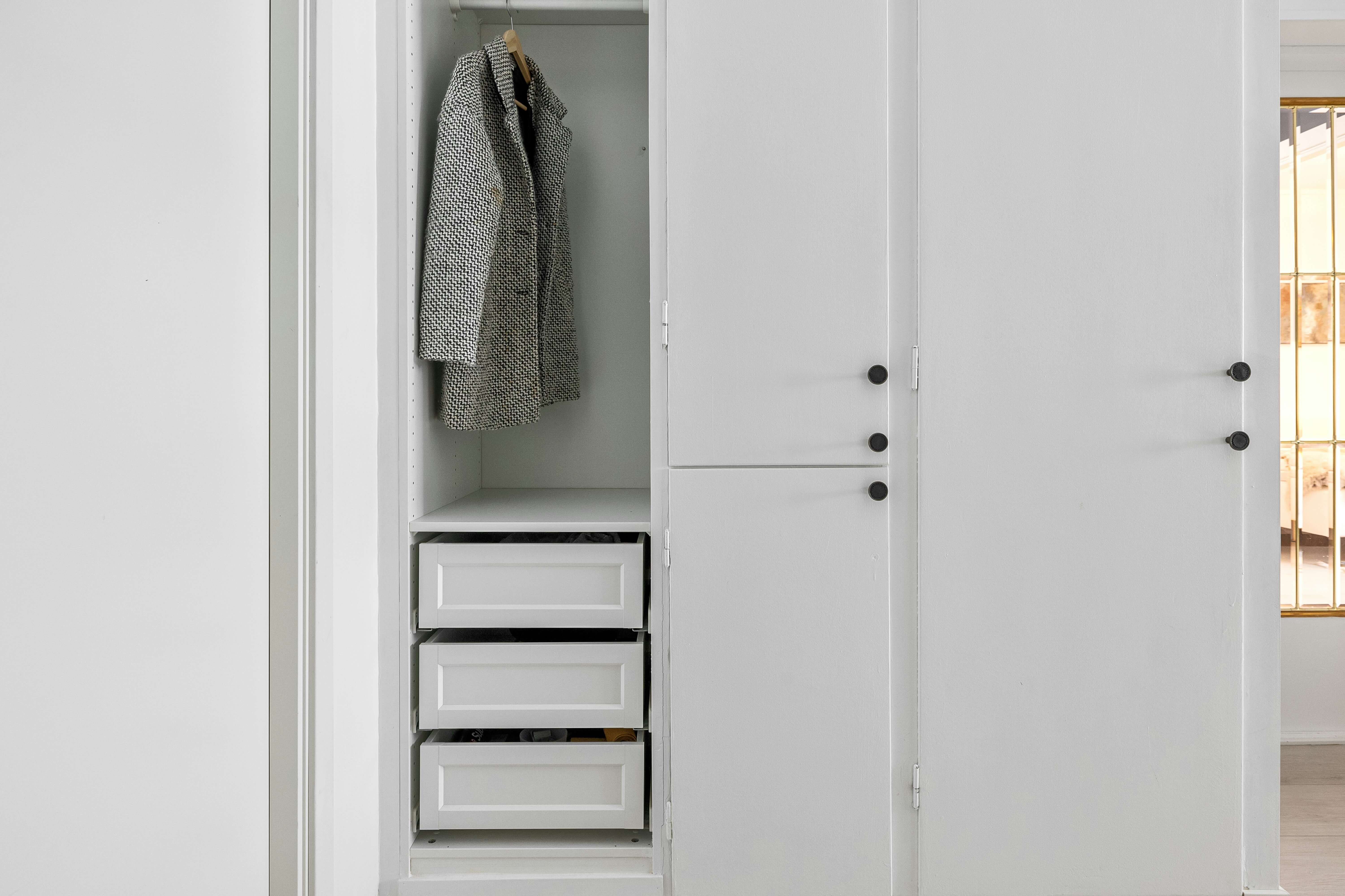 a bedroom with a bed and a closet