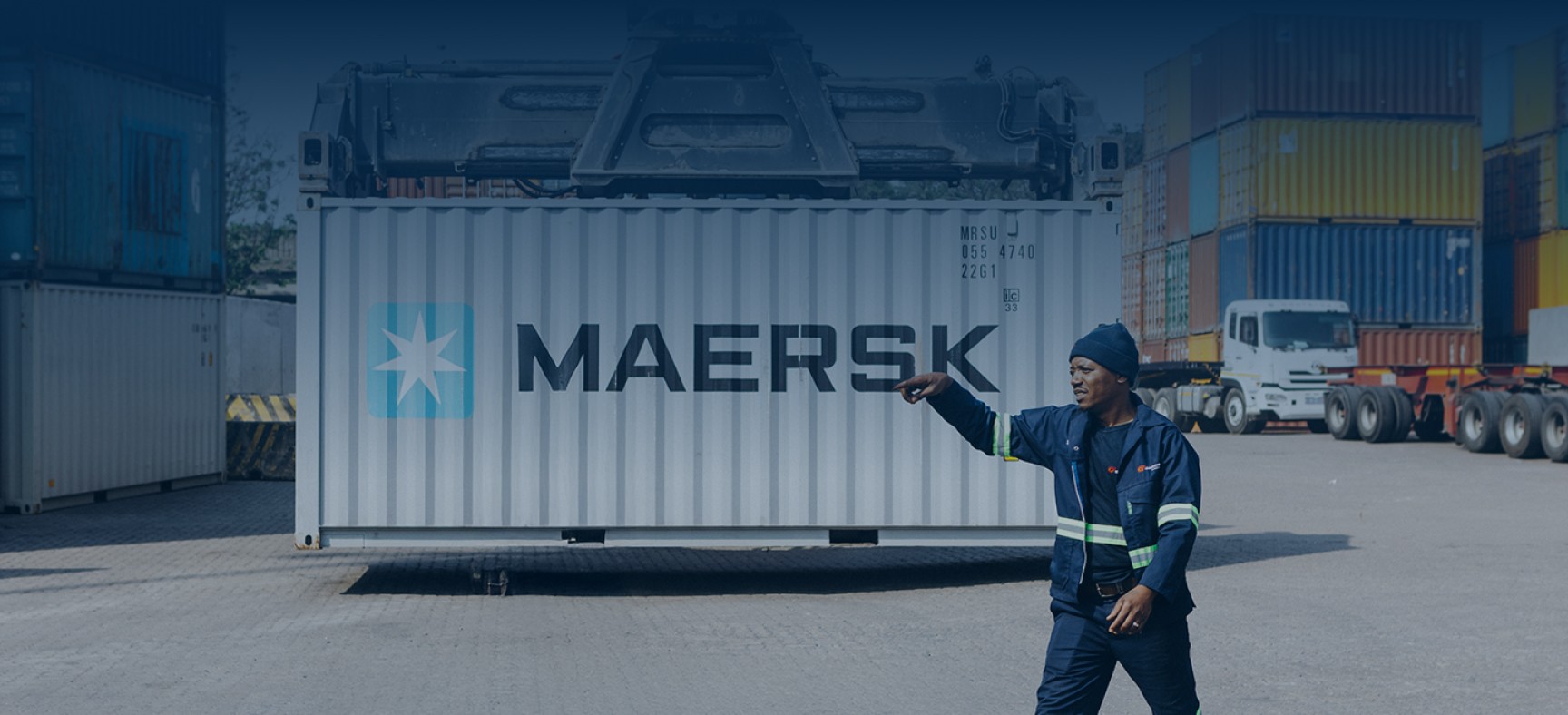 grindrod logistics staff moving shipping container in an inland container depot