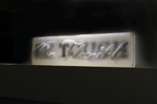 be touch banner with transparent straws arranged as a calligraphy text lit from above