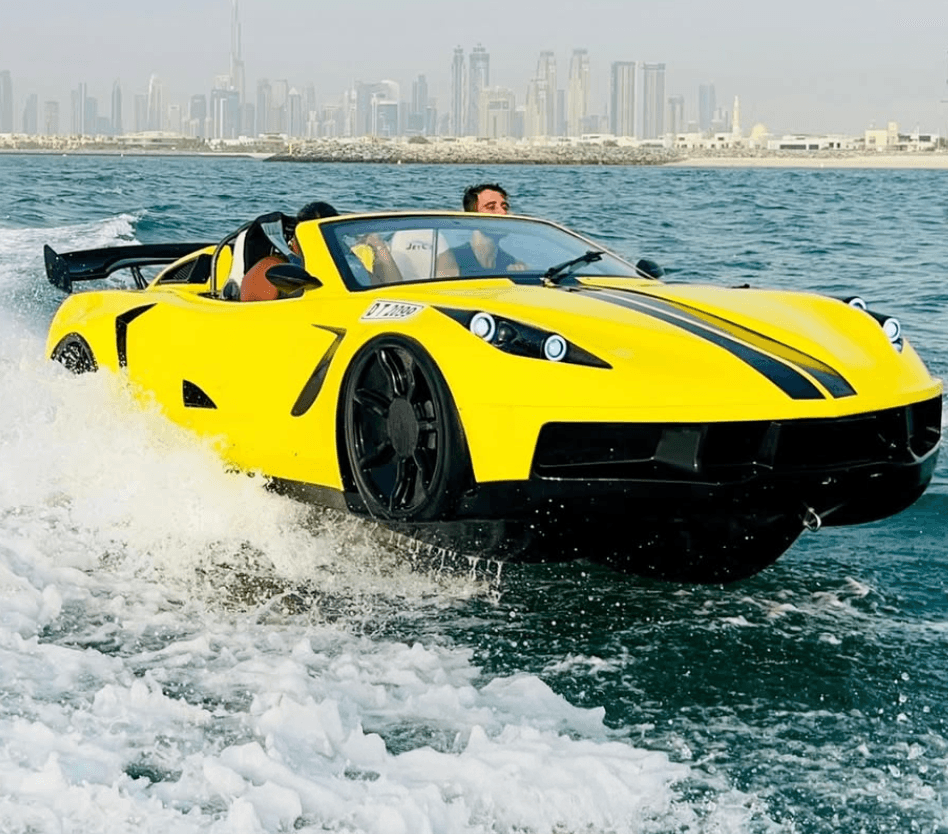 Man and young boy enjoying a jet ski ride on a yellow Yamaha near Burj Al Arab, Dubai.