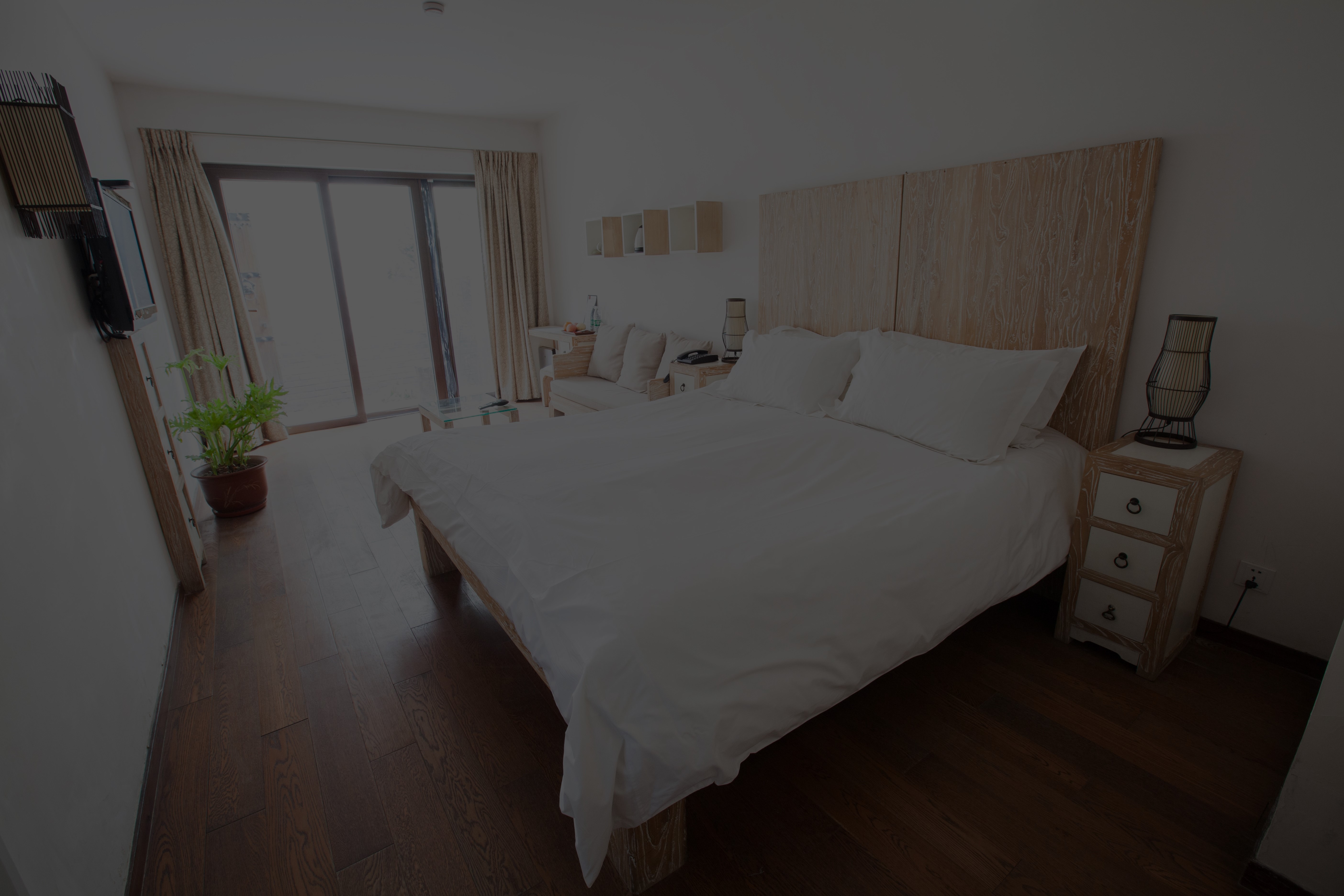 King room bed and warm wood interior