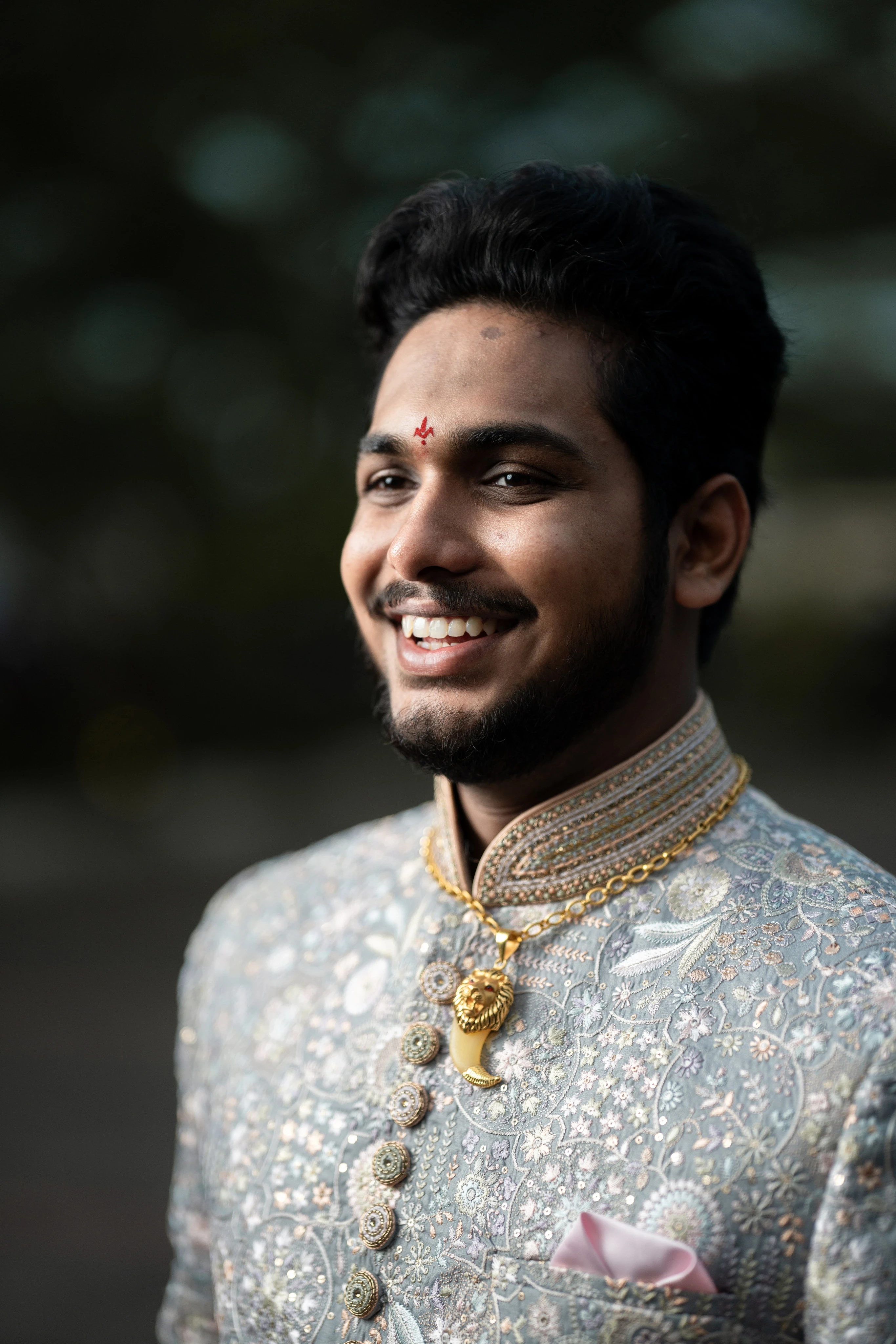 Rohit in a vibrant sherwani, radiating charm on his wedding day. Captured by Out of The Blues Fine Art Wedding Photography in Hyderabad.