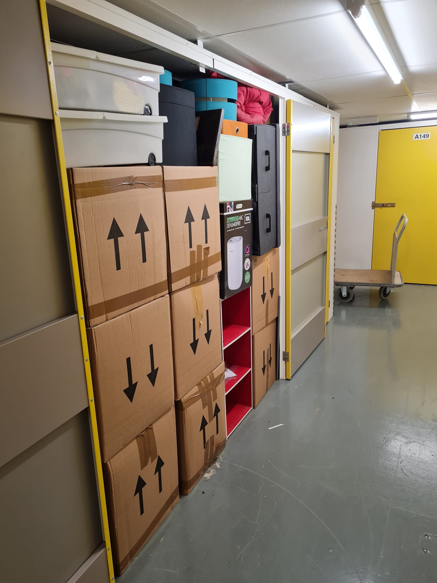 Meticulously stacked storage unit at UK Storage Plymouth, featuring professional packing by Moving On Removals with secure boxing and strategic organisation to maximise space.