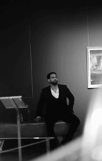 Jonathan Richardson - creator of the online course "AI in Business", wearing a suit, exuding confidence and professionalism.