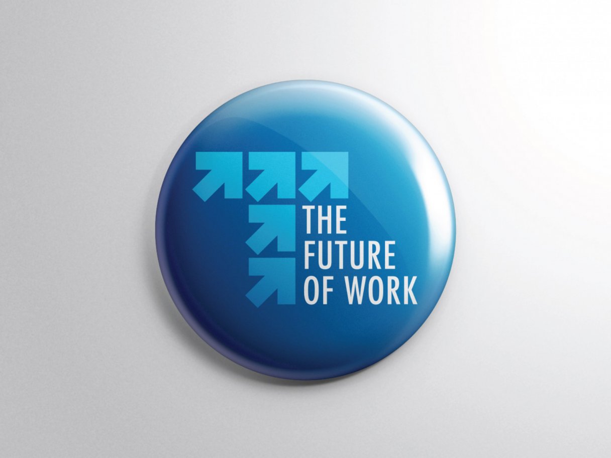 Rooftops of a coastal town with the sea in background