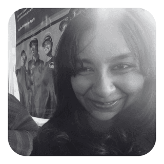 Stylized blue-toned illustration of a bearded man in profile wearing glasses and a collared shirt.