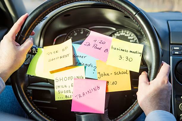 To do list post-its on a steering wheel