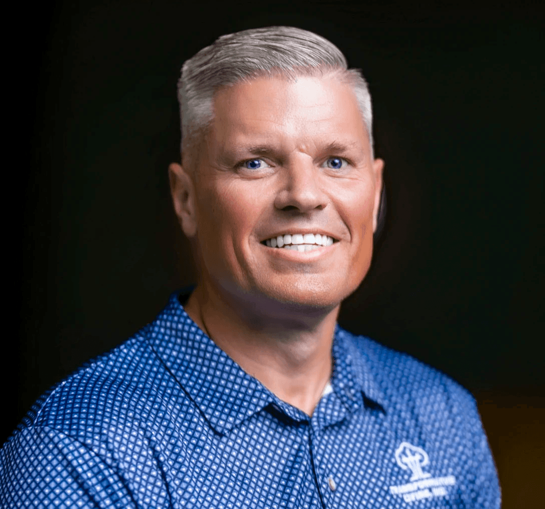 A woman smiling while working at a computer
