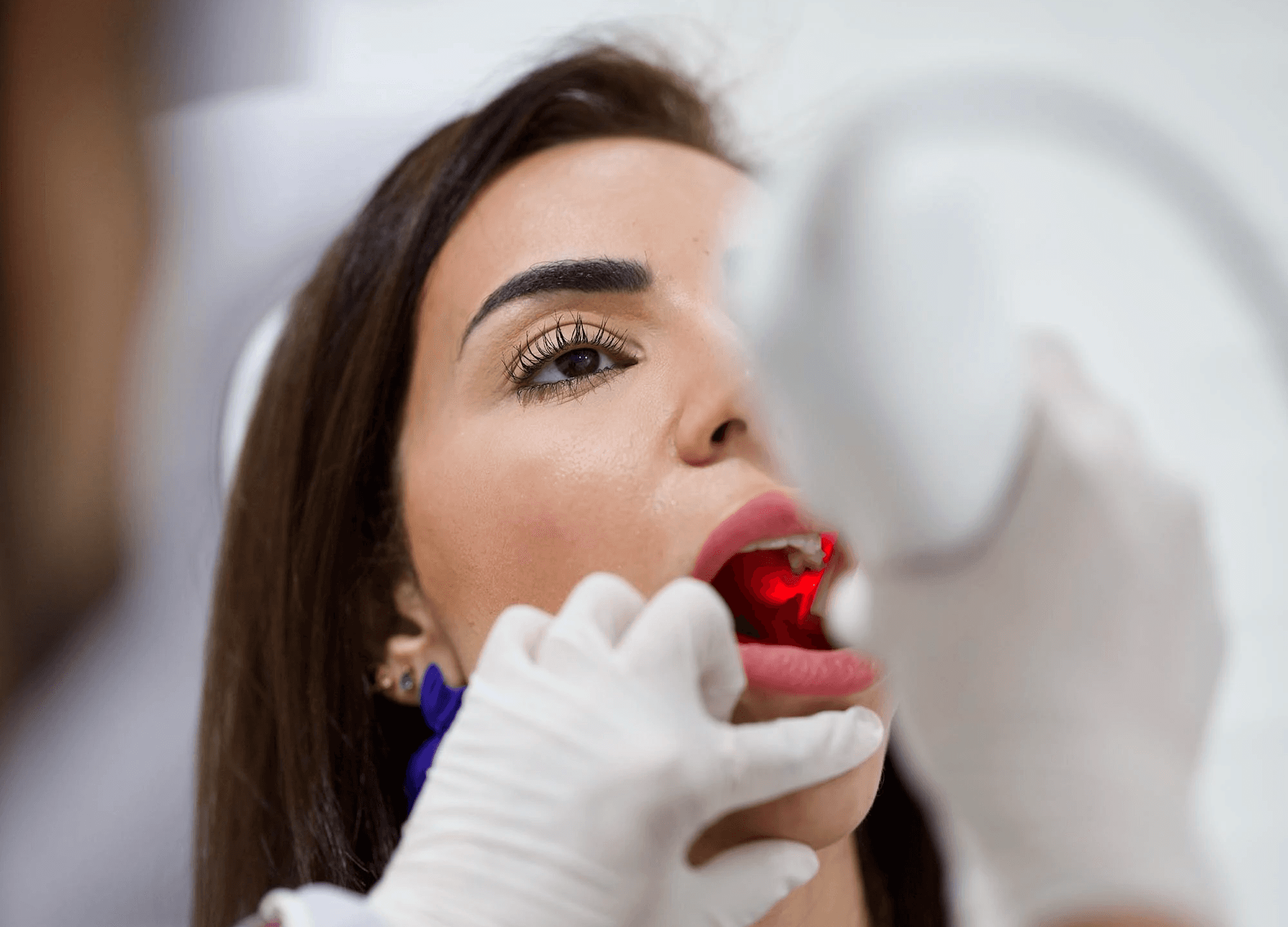 A general dentist doing a regular check-up for a client, reinforcing the need for routine care, similar to dog dental hygiene by Invisalign Center