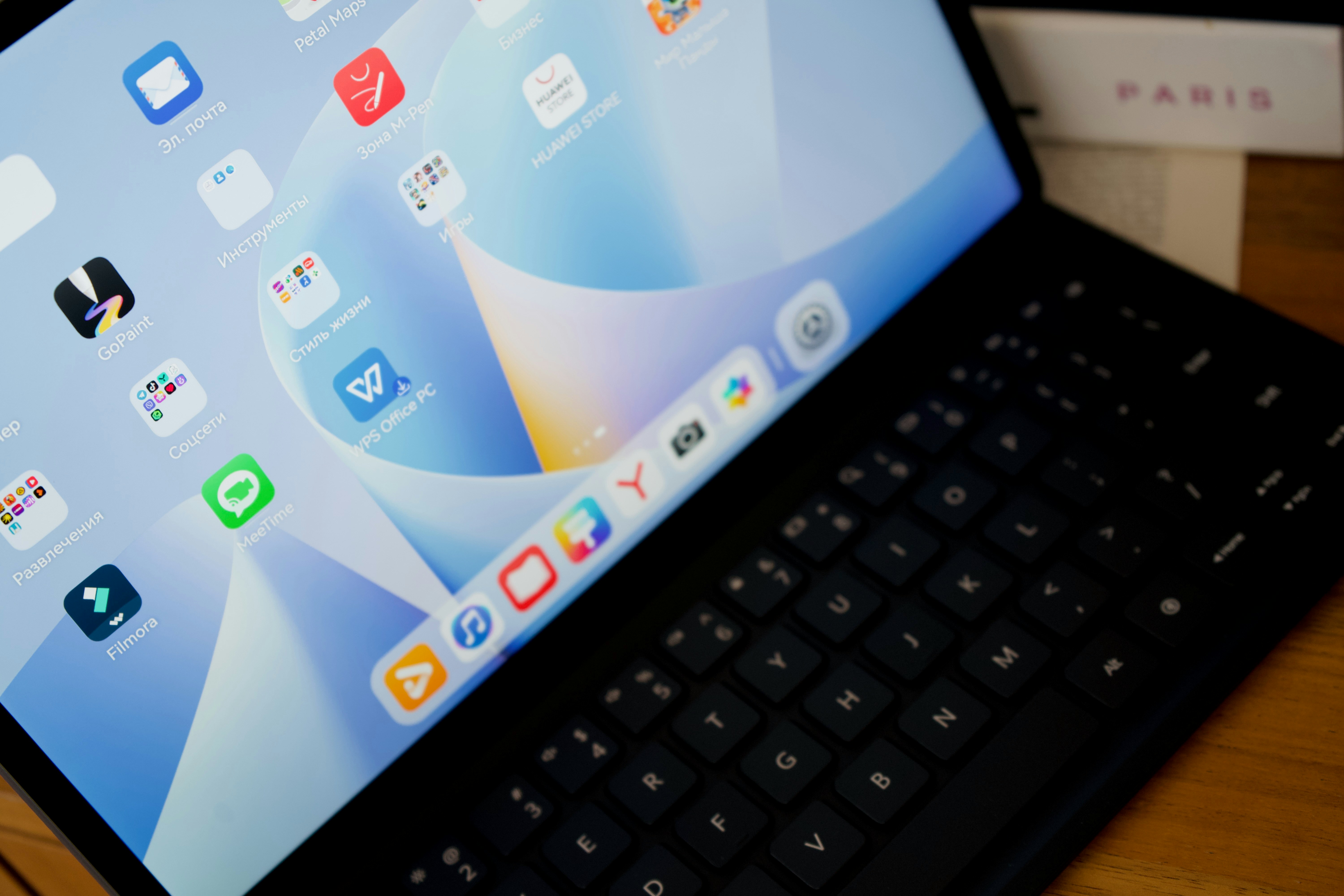 Tablet home screen displaying video editing apps including Filmora and creative tools