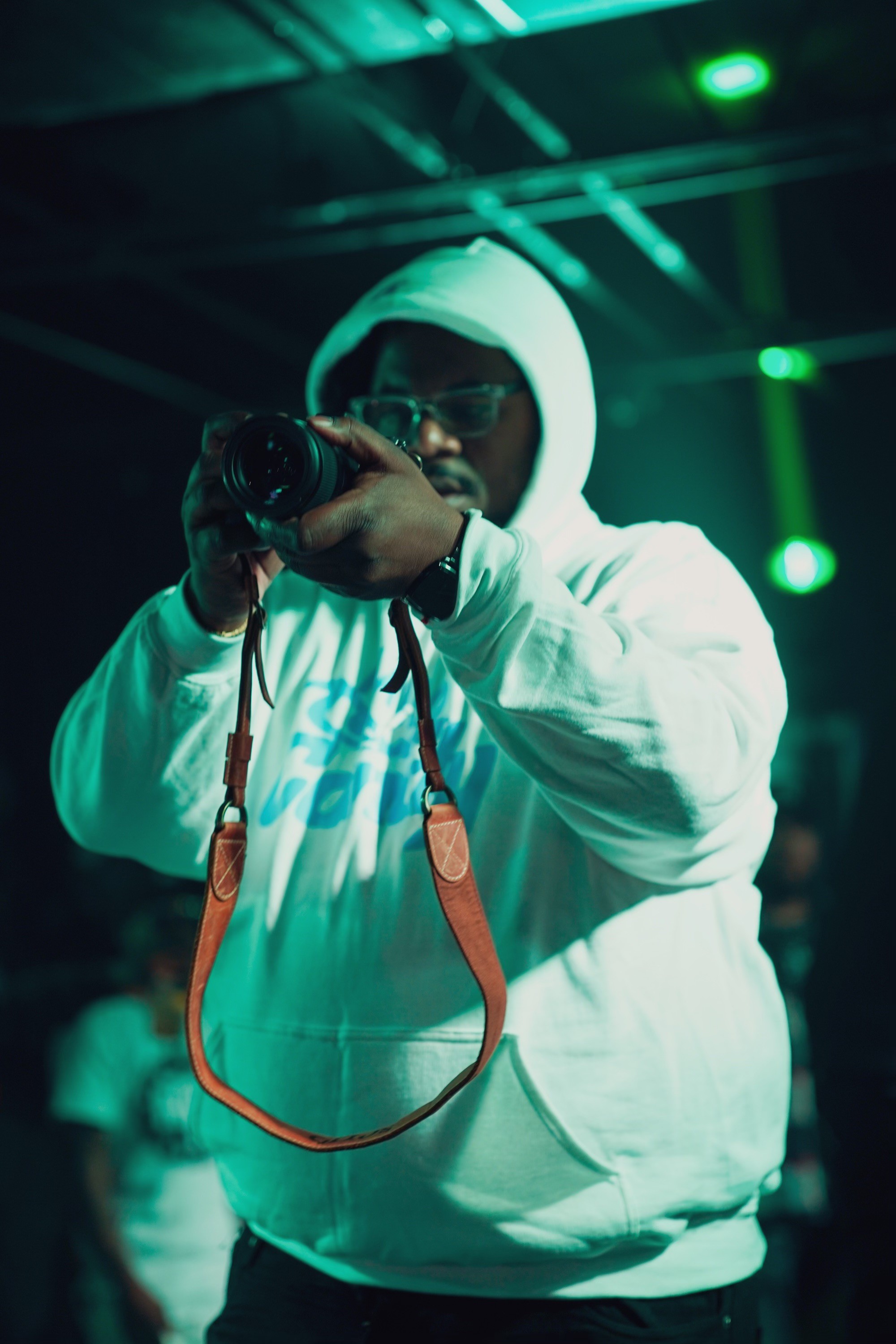 image of a man taking a selfie from a pov while wearing a red sweatshirt