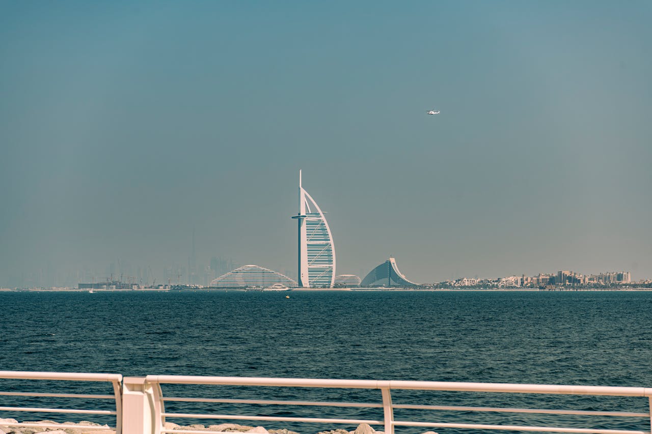 Palm Jumeirah Boardwalk with the view of Burj al Arab in the distant background.