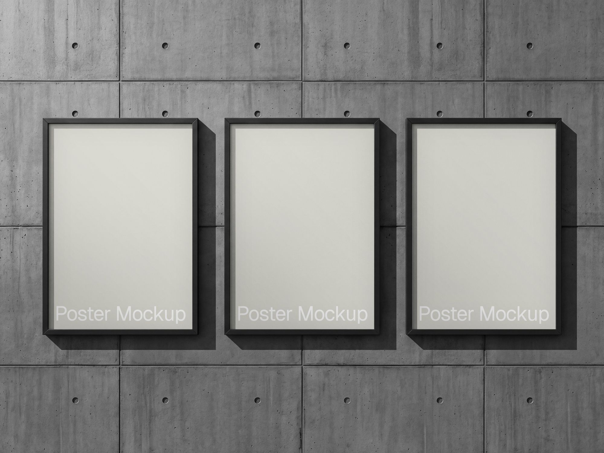Concrete wall poster mockup with three black framed prints in a front view