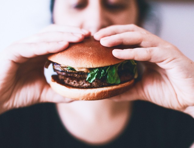 Eating a plant based burger