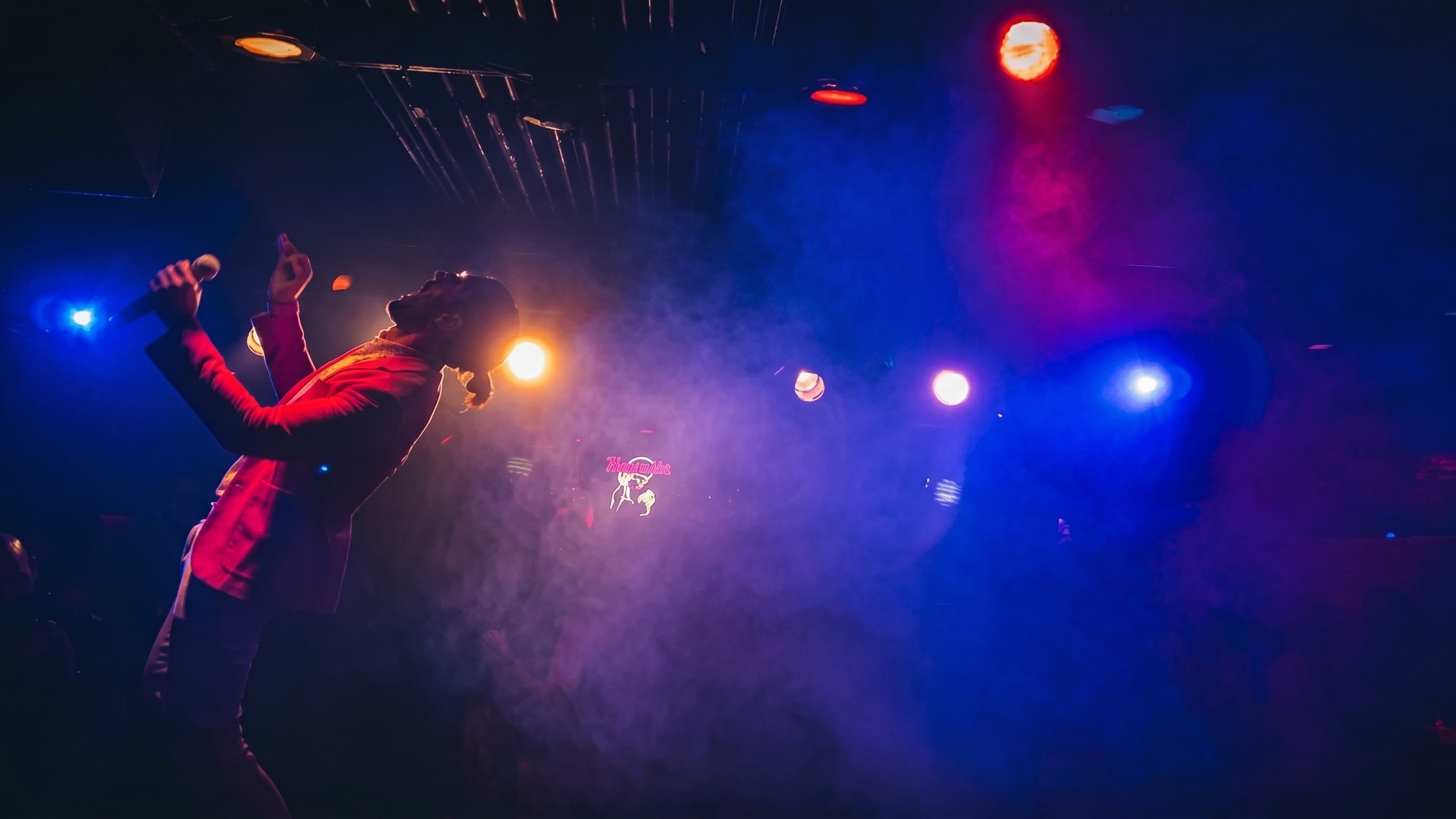 Concert stage lighting over an audience