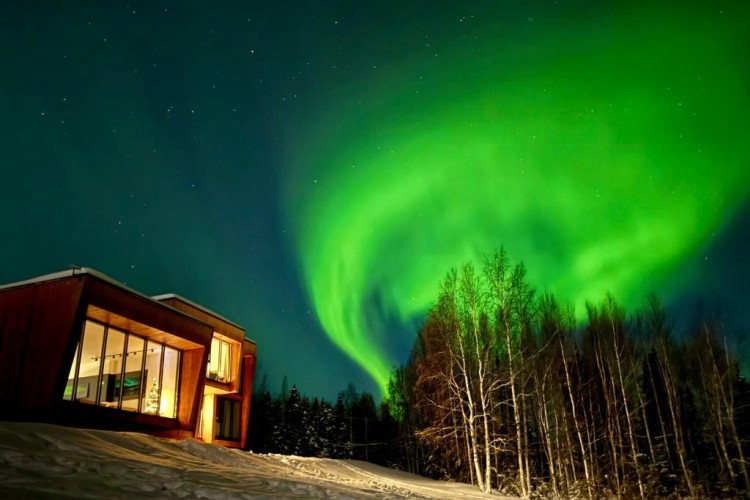 sunloungers fronting buildings near mountain