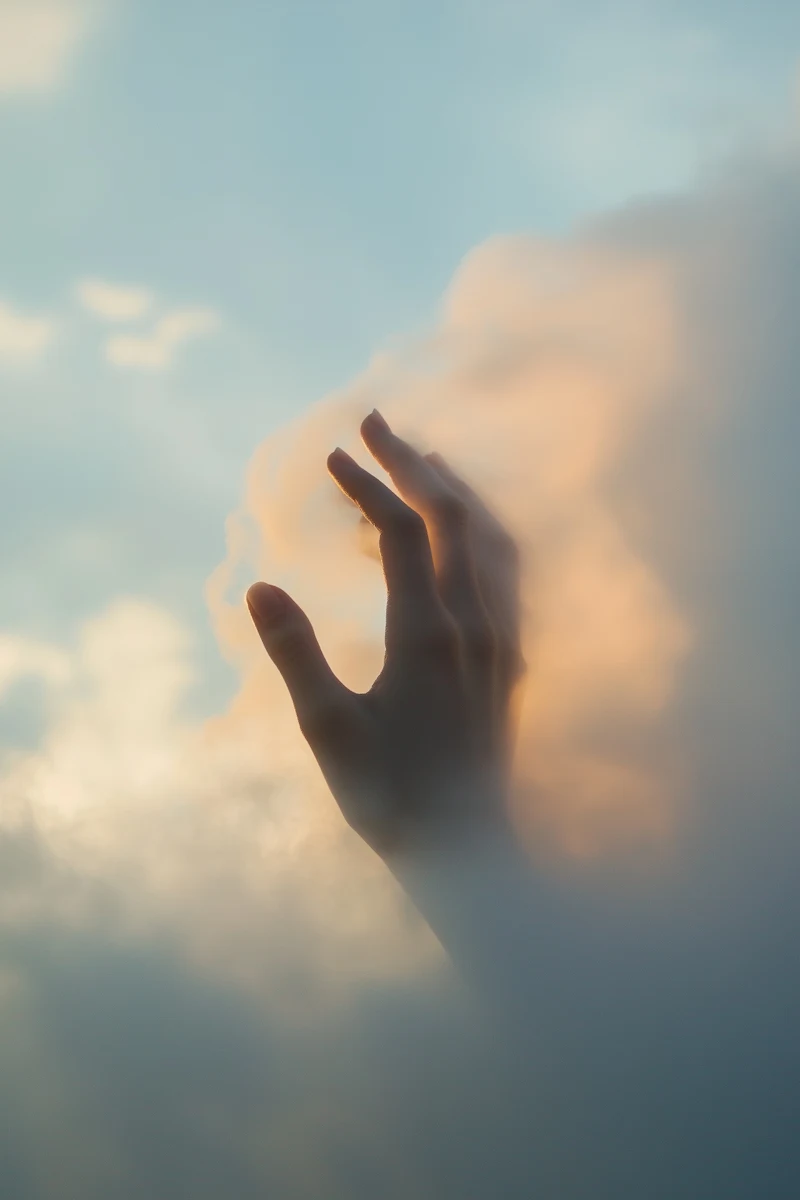 hand in clouds