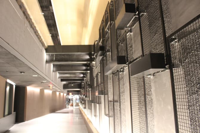 Dark tiled wall with a bright ceiling