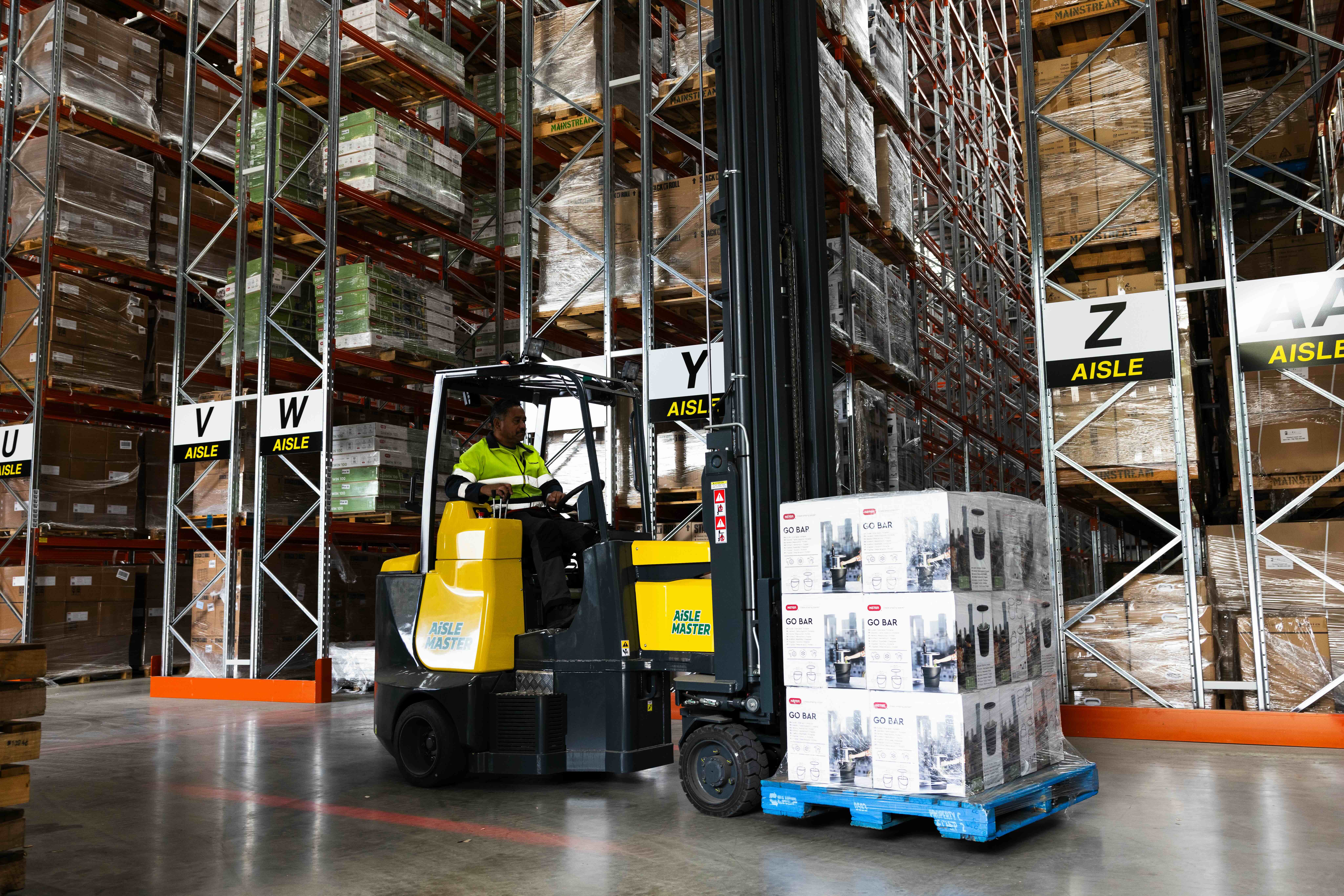 Male engineer in uniform and hard hat with arms crossed