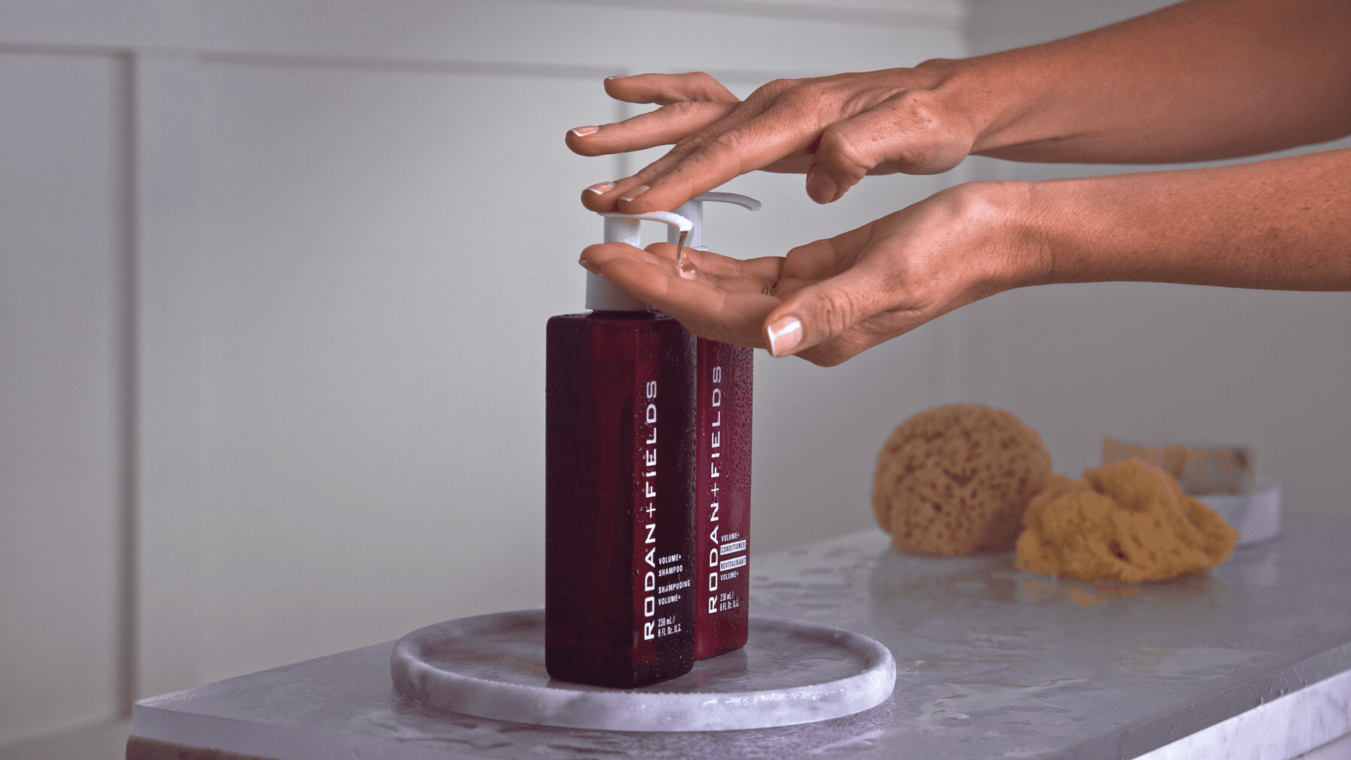 Close-up of Rodan + Fields shampoo and conditioner