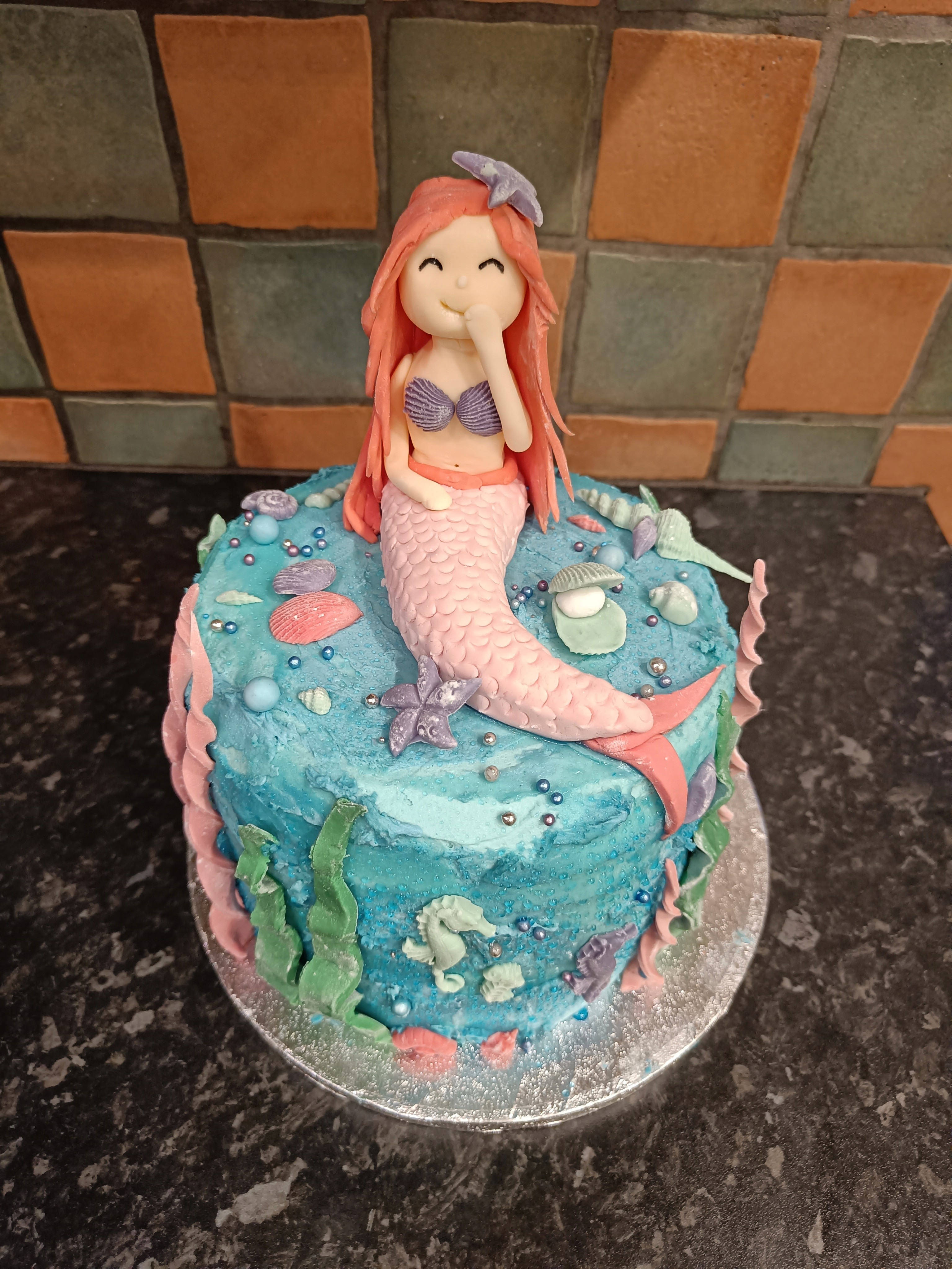 Mermaid-themed decorated birthday cake.
