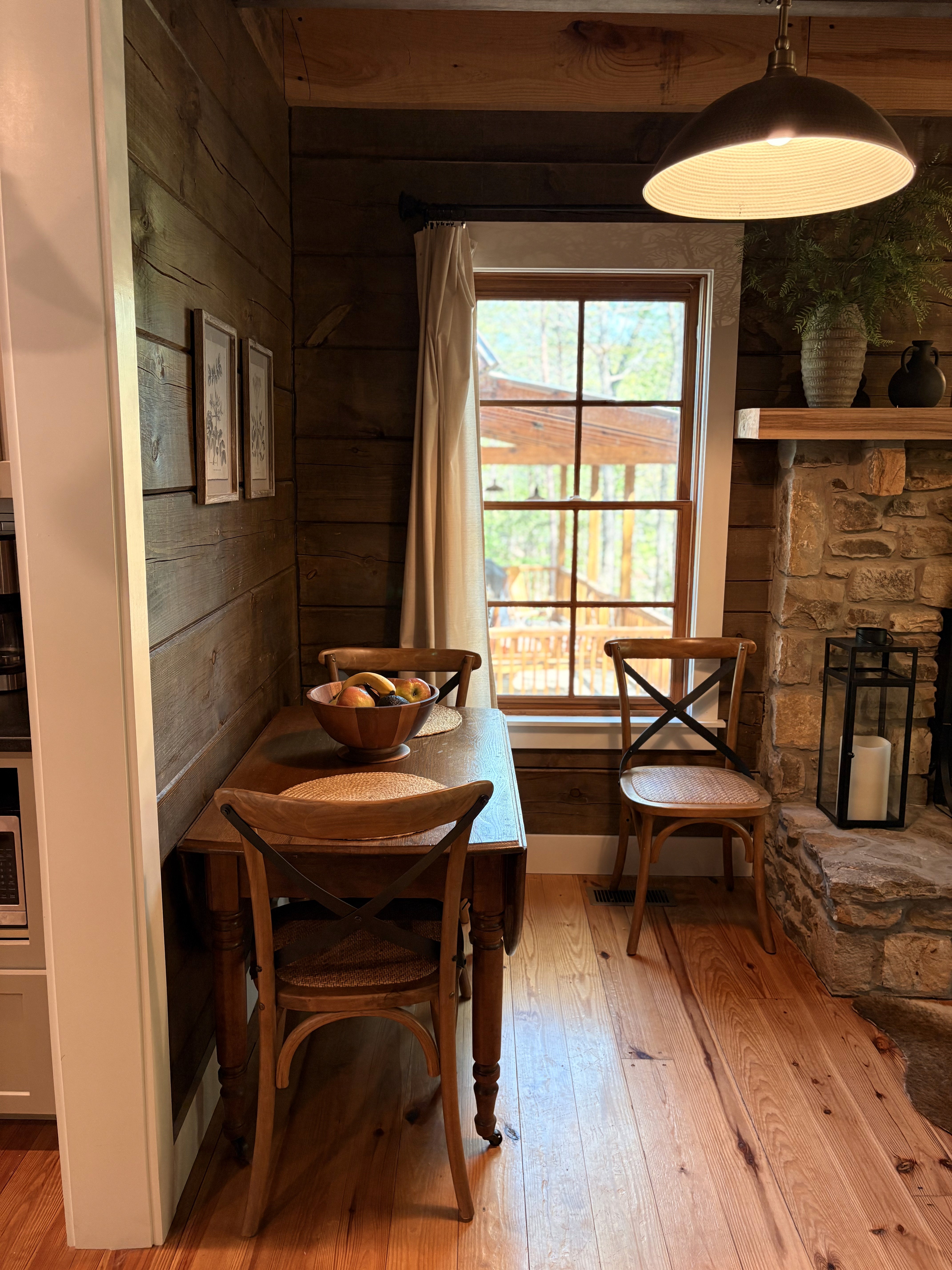 Cabin glowing in woods