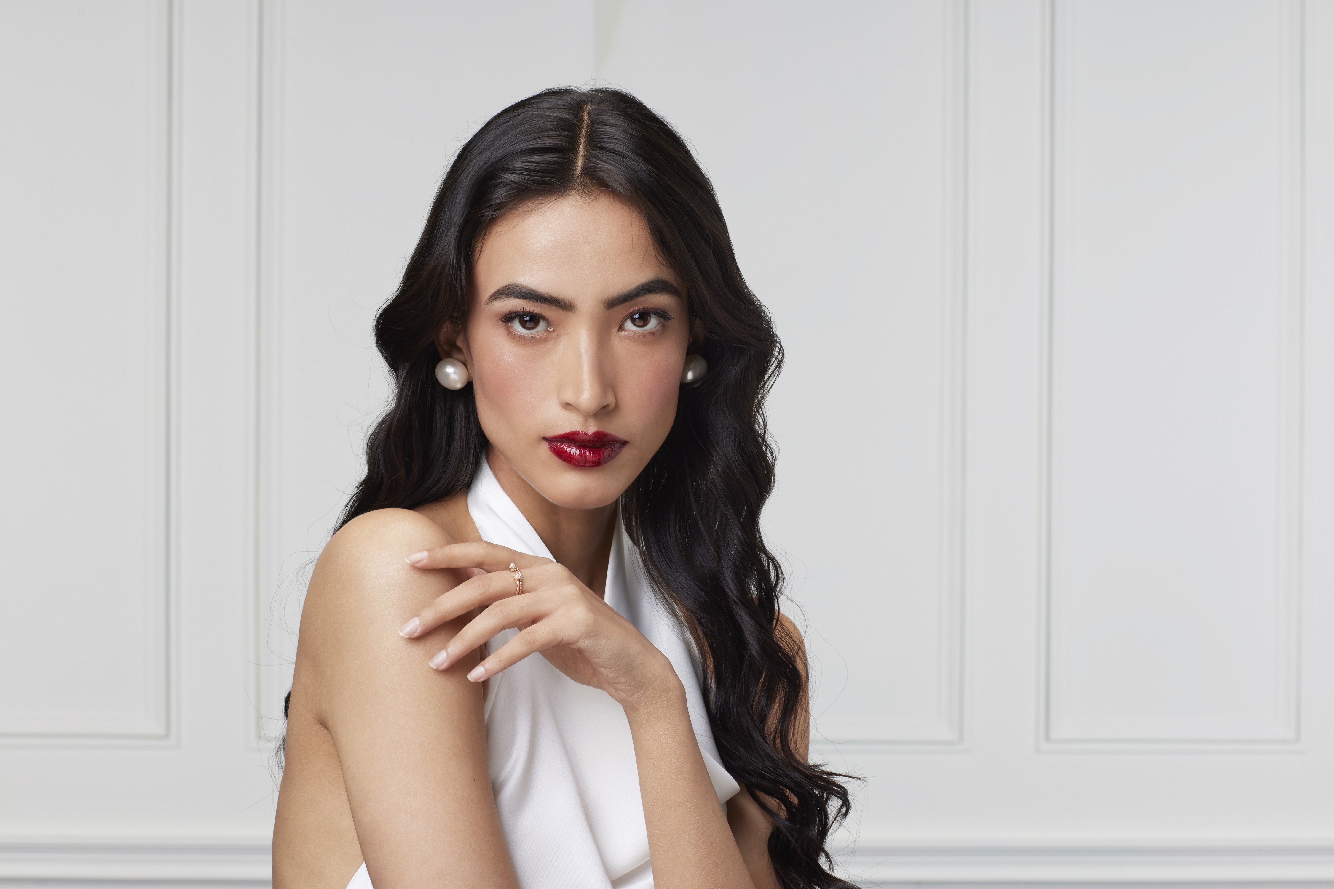 Group of friends smiling on a lively city street at night
