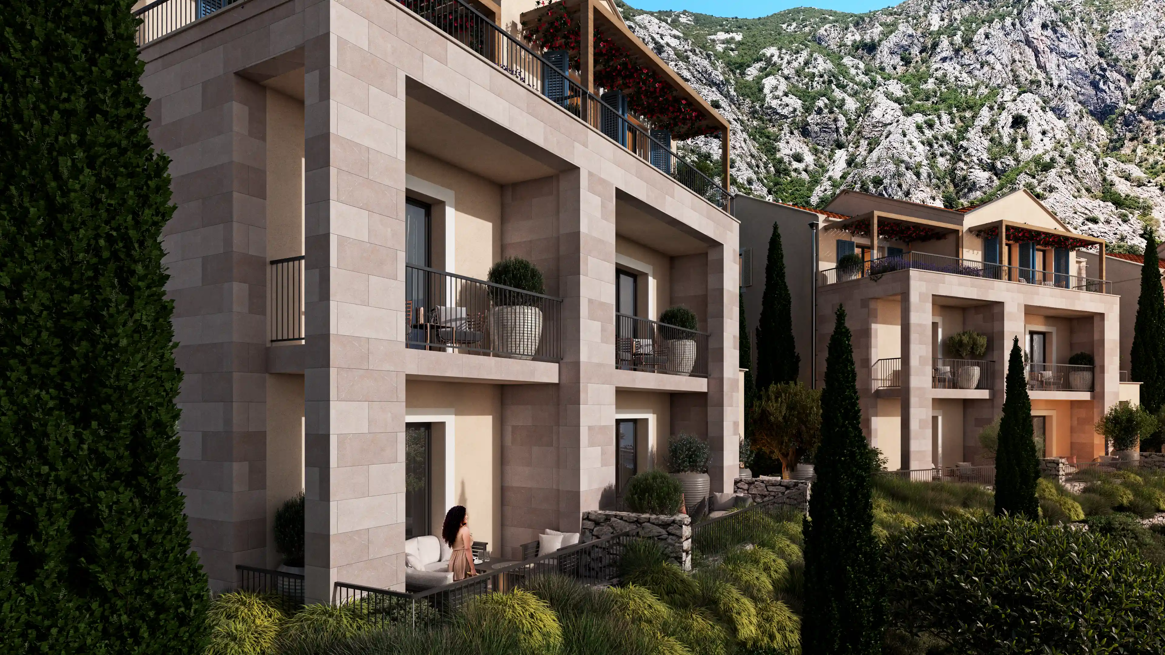 Mediterranean-style Olive Grove Residences with lush gardens and mountain backdrop.