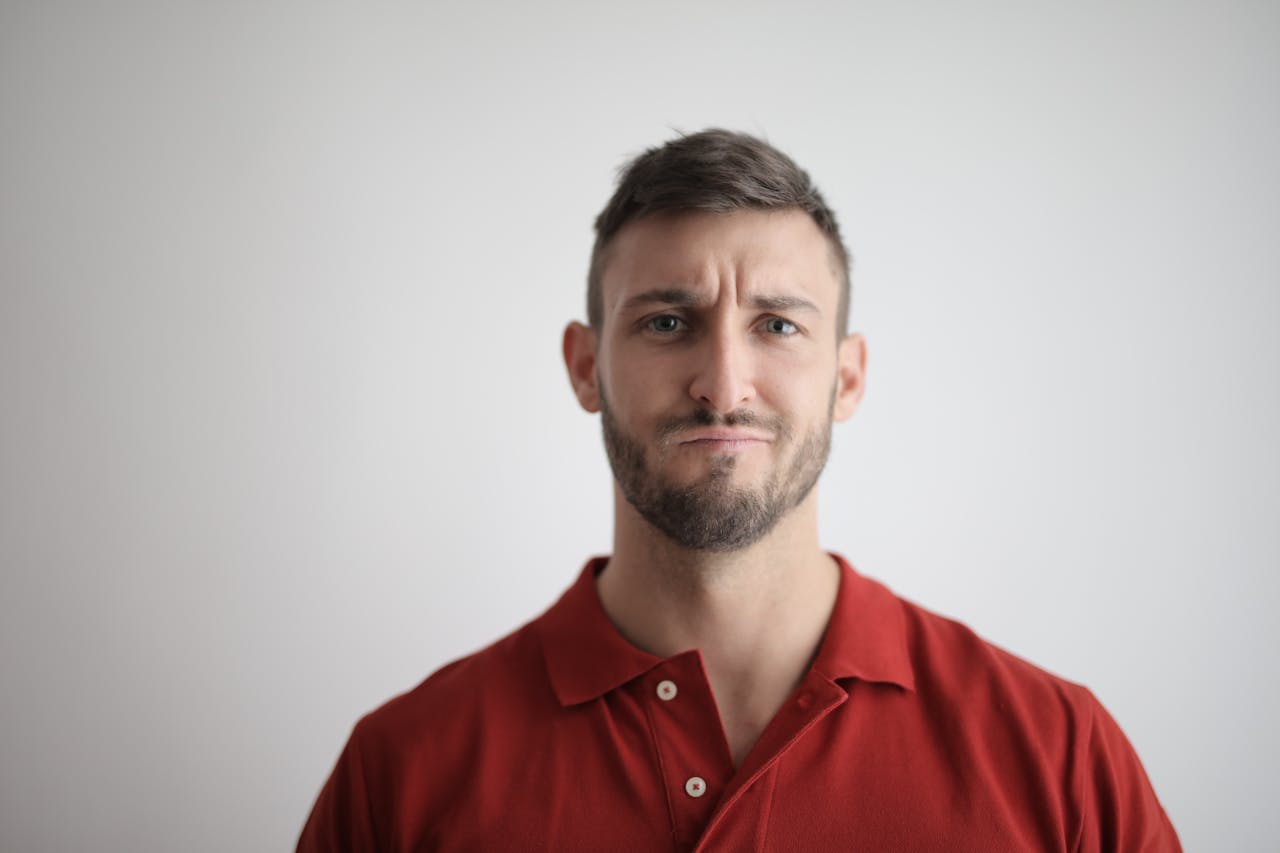man in red shirt smiling