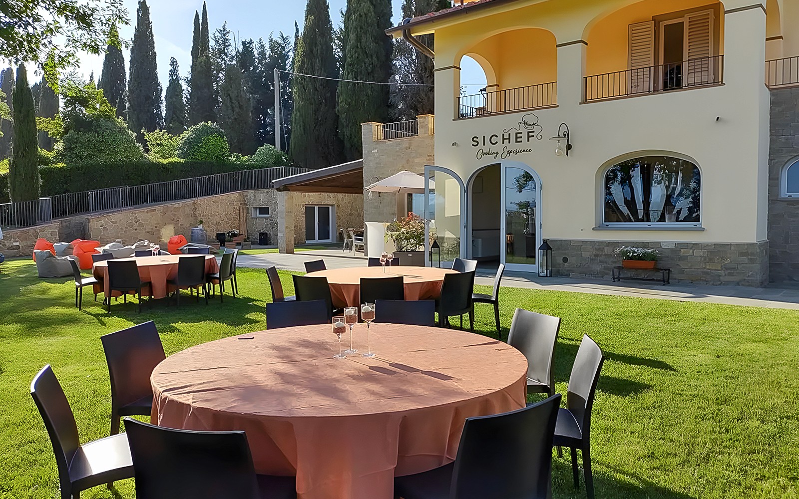 Outdoor dining setup for wine tasting and dinner in Chianti, Italy.