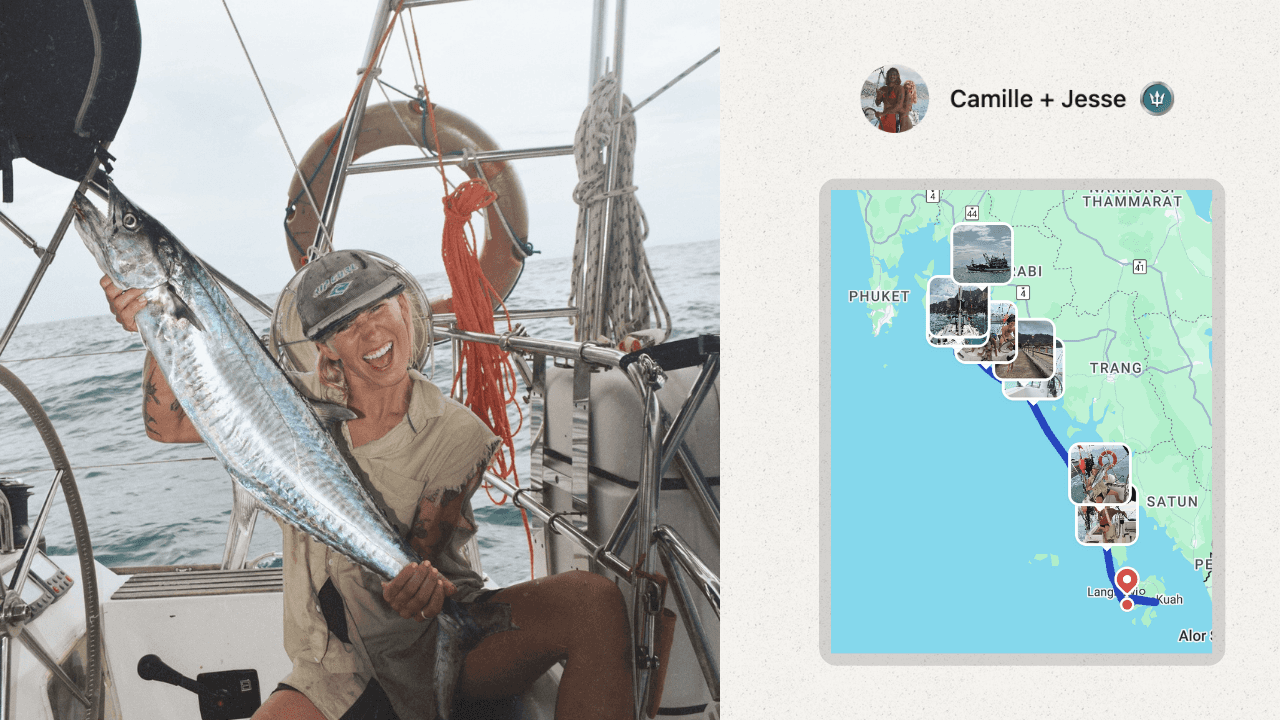 A woman on a sailboat in Thailand catching a fish