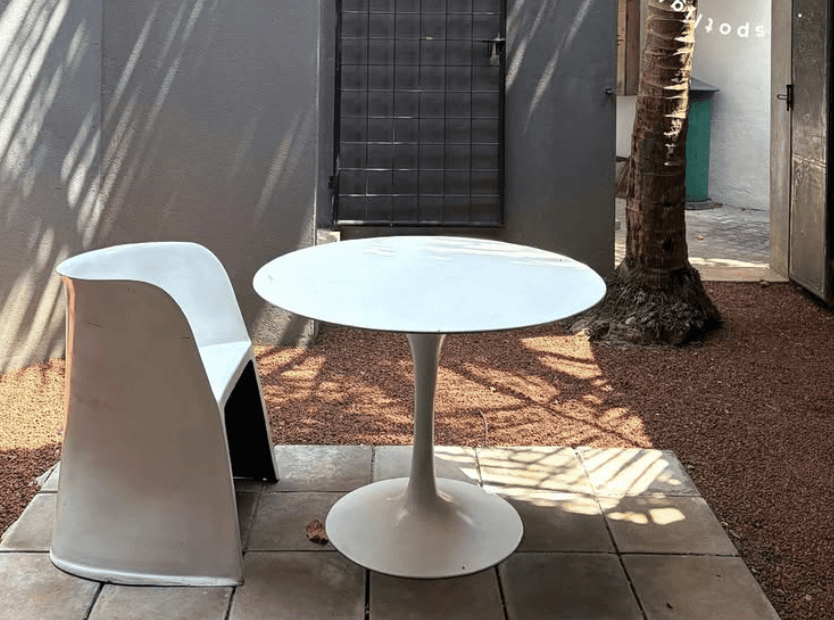 a group of women standing on top of a sandy beach