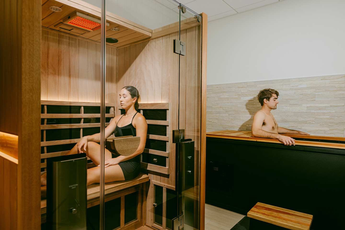 Man and woman receiving contrast therapy. 