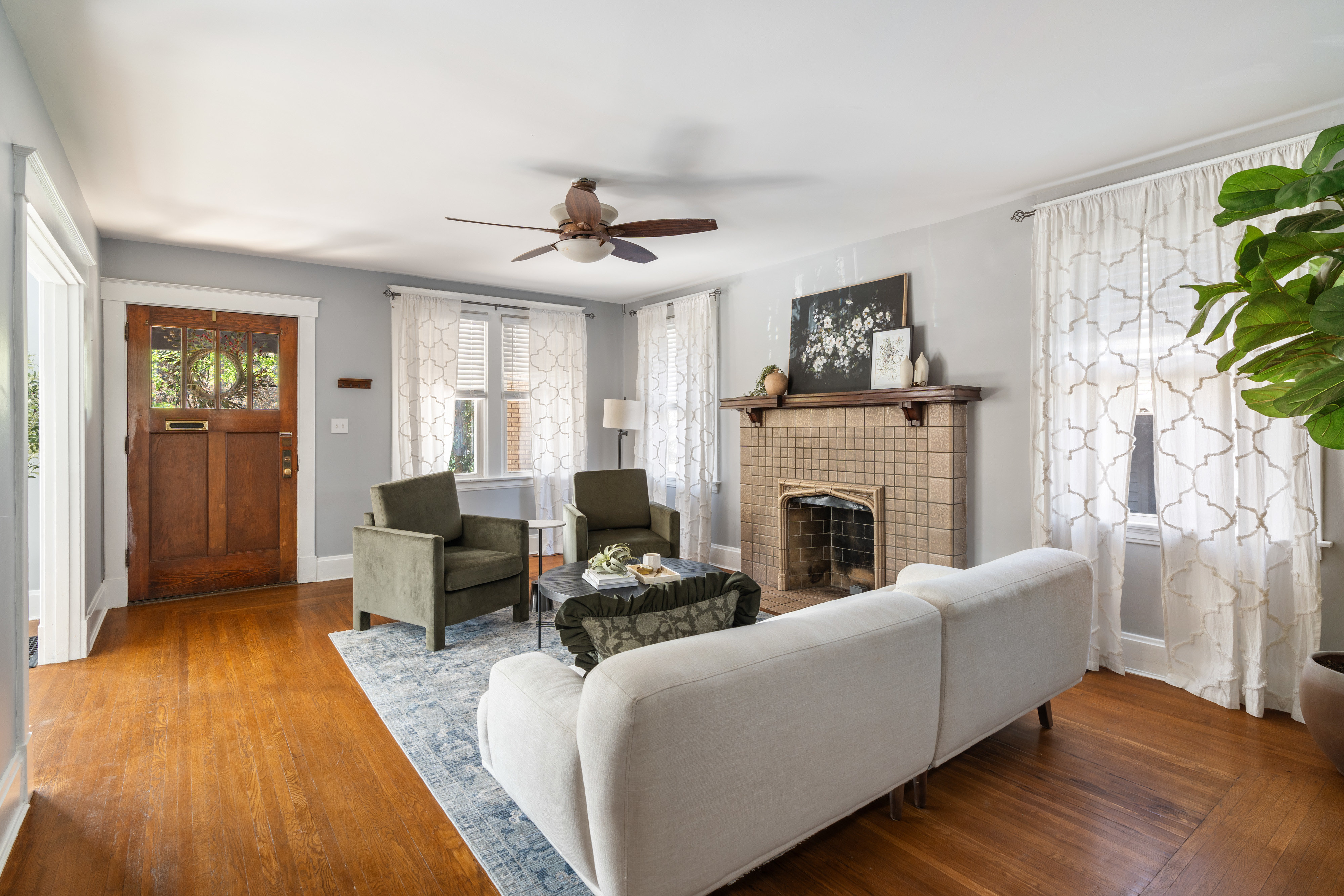 woman in white sleeveless dress sitting beside woman in white sleeveless dress