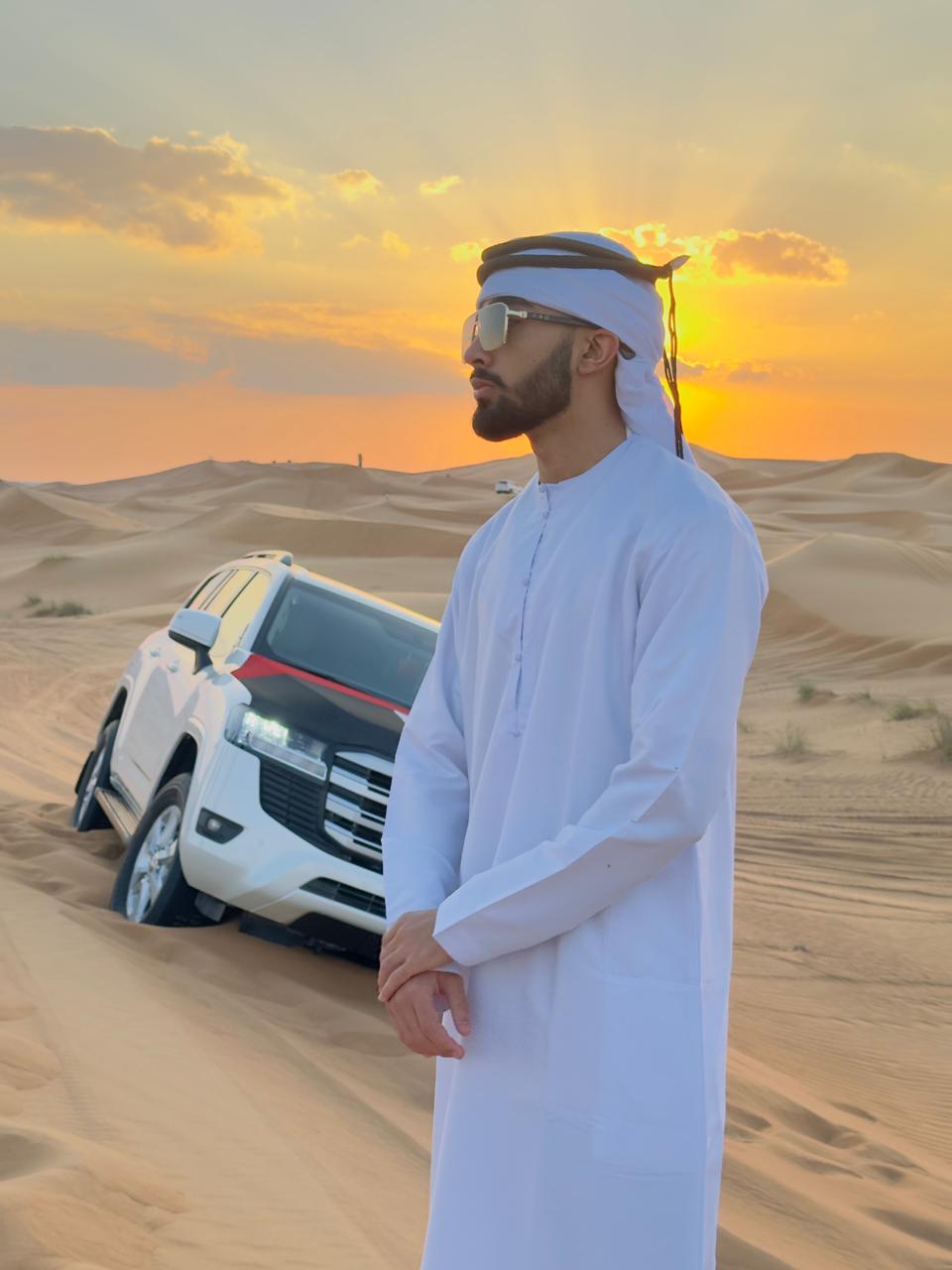 Nischal Poudel in dunes at sunset in kandura
