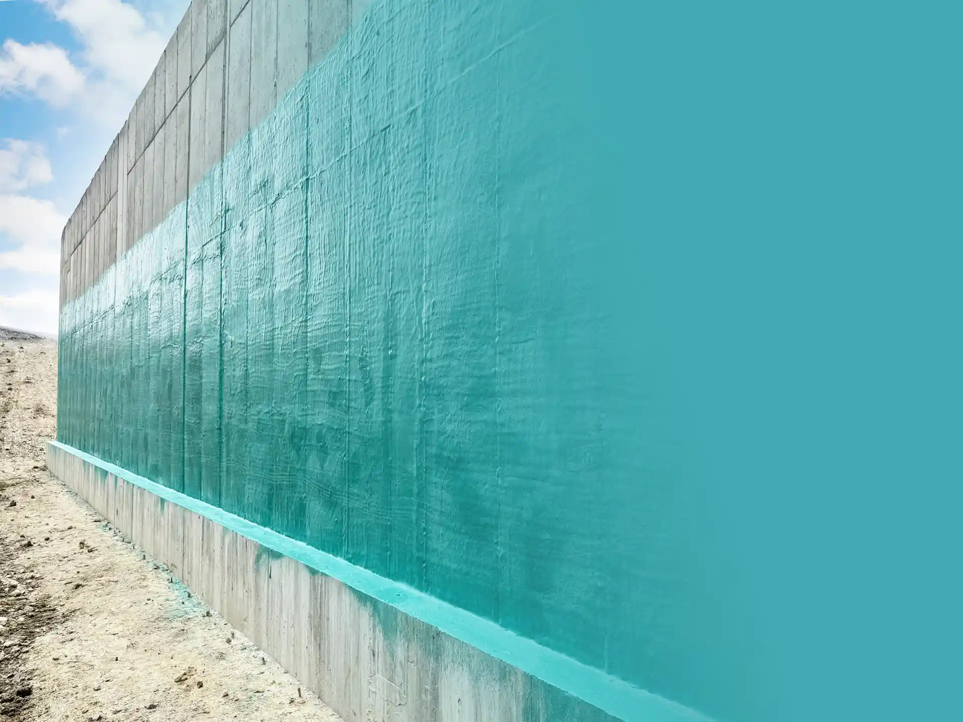 Rub-R-Wall waterproof coating on a concrete foundation of a commercial building