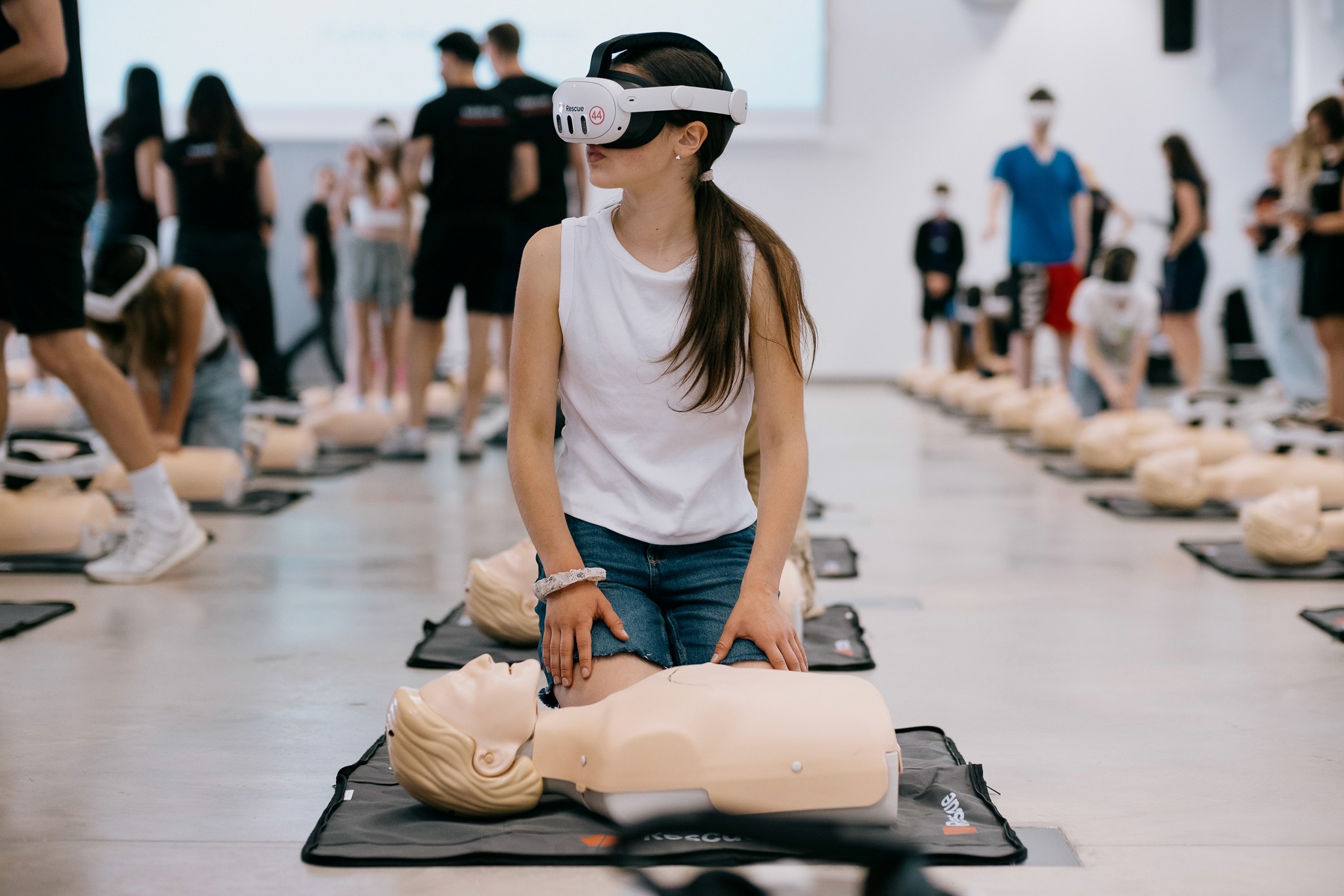 two people looking at a tablet and smiling